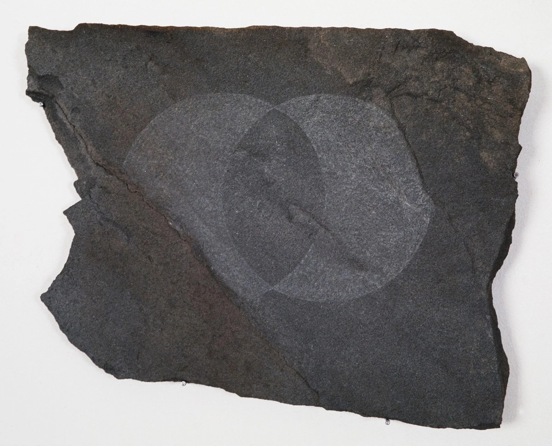 Matthew Deleget, Petroglyph (Vesica Pisces), 1996, Scraped slate stone, Approximately 15 x 15 inches