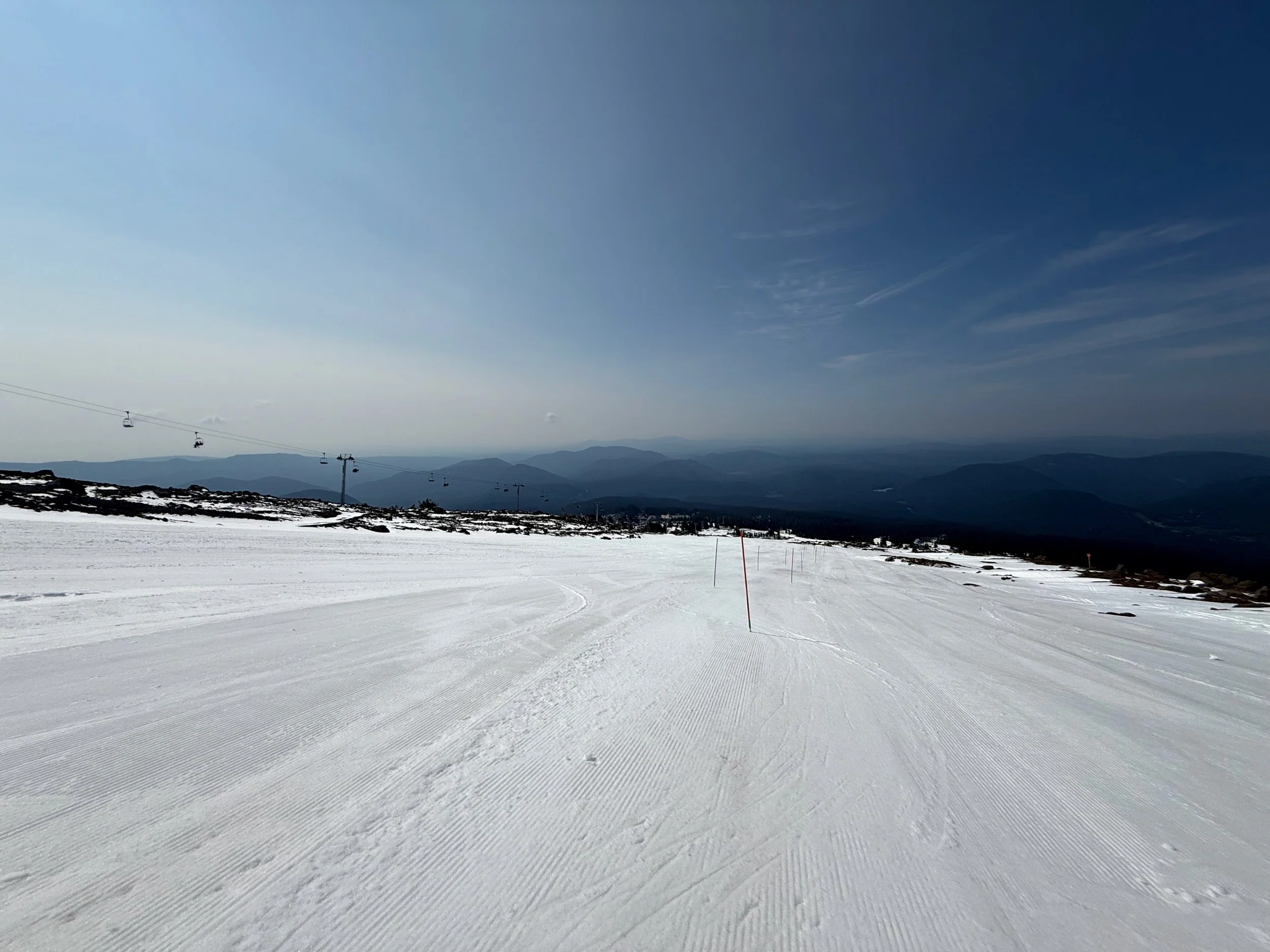 Mt Hood ski racing camp slalom training on Palmer Glacier with chairlift and mountain backdrop