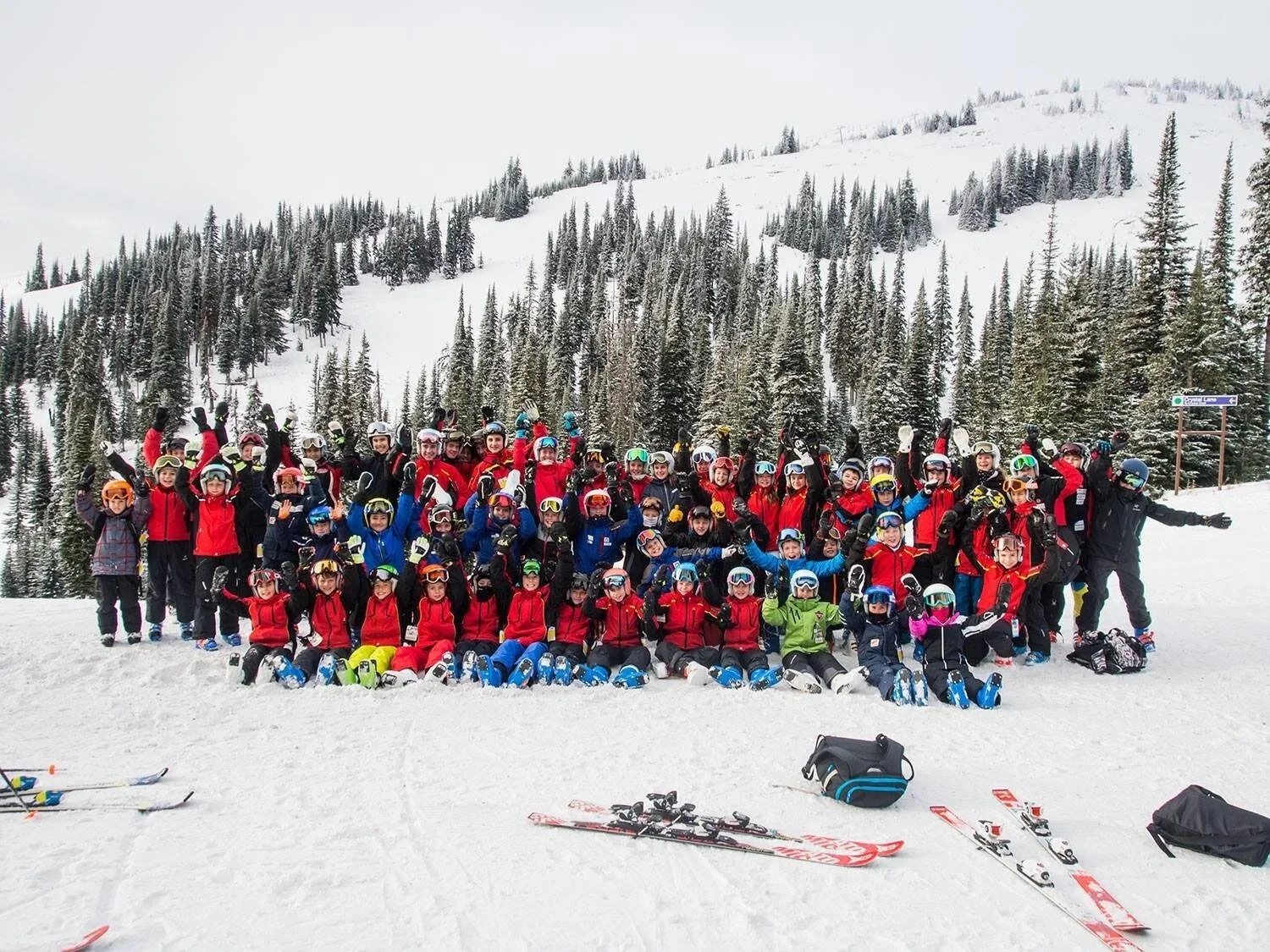 Large group of junior ski racers and coaches at Sun Peaks winter training camp in British Columbia