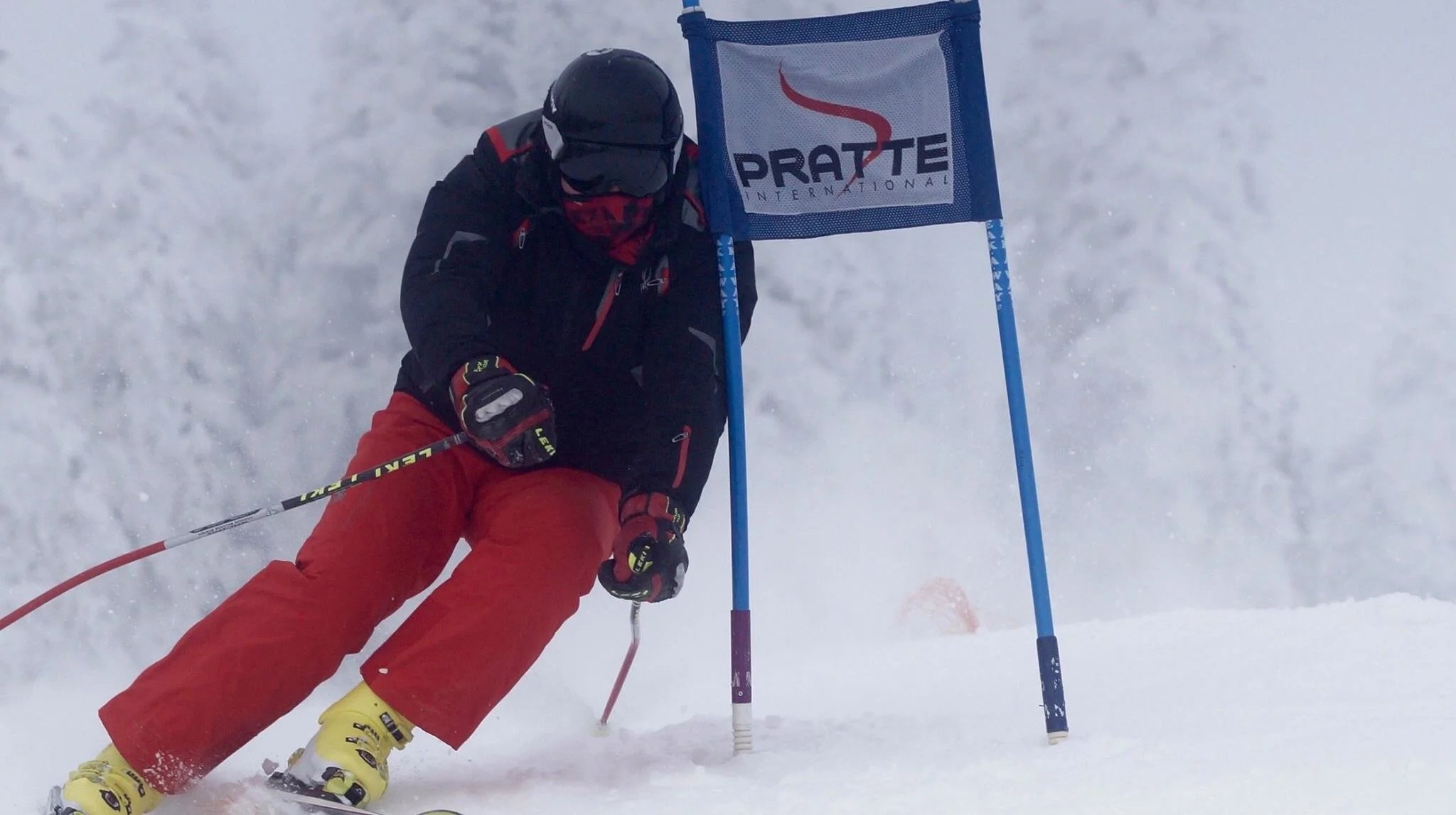 Wide groomed ski race training course at Mont-Tremblant winter camp with evergreen forest