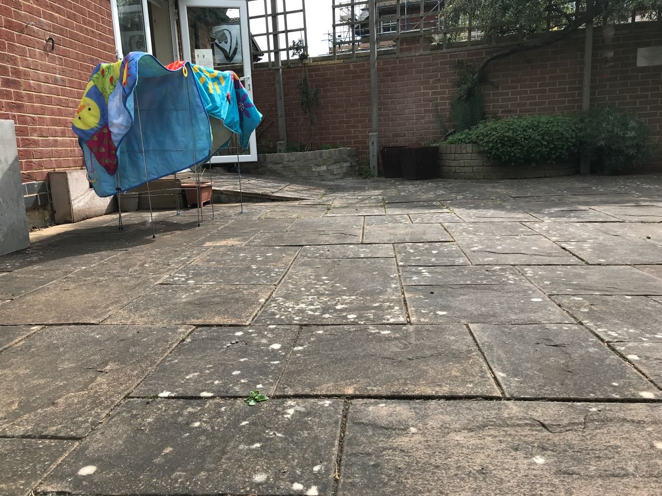 outdoor uneven tiled space.JPG