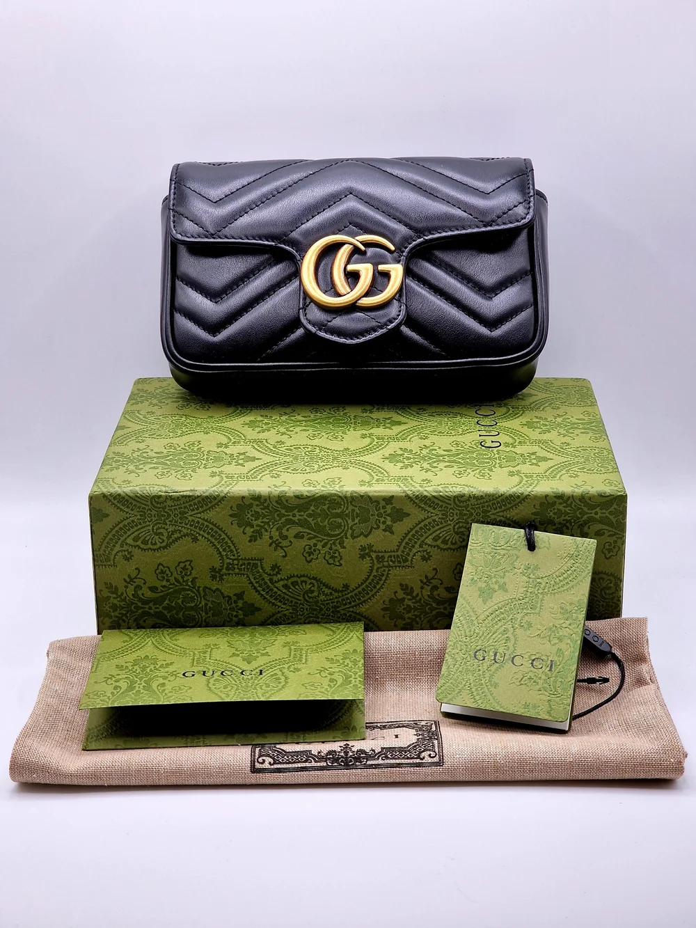 Gucci GG Marmont Matelassé Leather Super Mini Bag — Luxe & Beyond