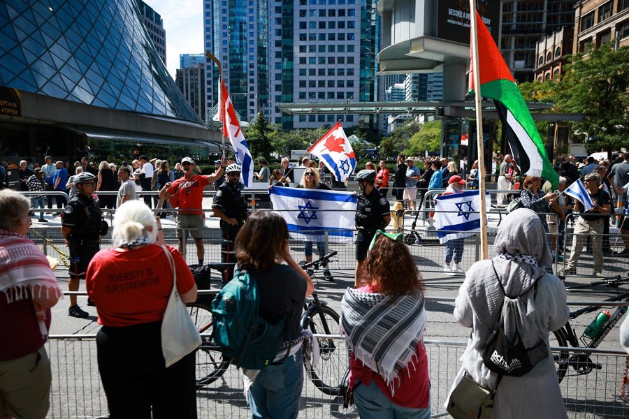 Demonstrators rally in front of Roy Thomson Hall, where the documentary ‘The Road Between Us: The Ultimate Rescue’ was set to premiere at the Toronto International Film Festival in Toronto, Canada, on September 10, 2025.