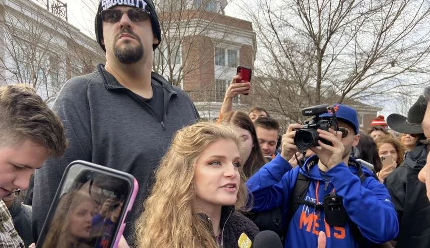 Kaitlin Bennett alongside her bodyguard. Photo by Ben Peters.