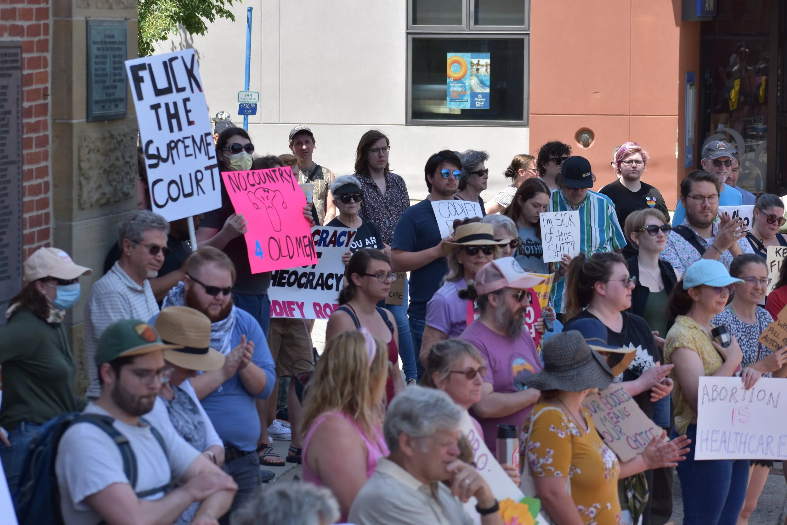  Protestors stand outside the Athens County Courthouse in support of abortion rights. Photo by Bo Kuhn. 