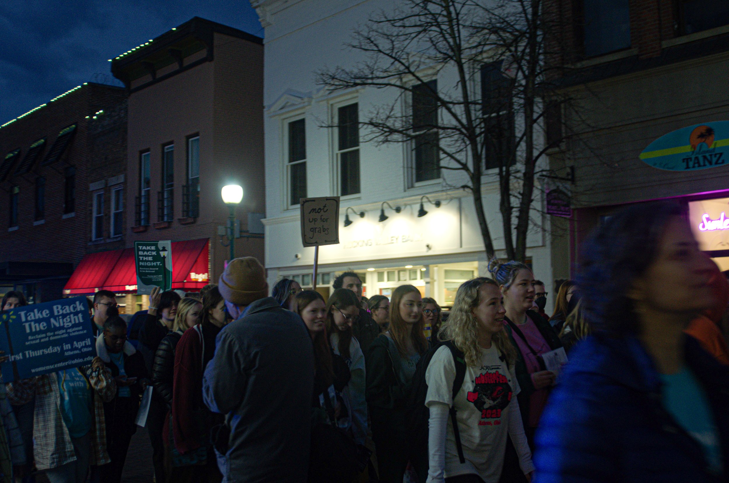  Students gather outside of The Athena Cinema make their way to the streets.  Photo by Jessica Horner.  
