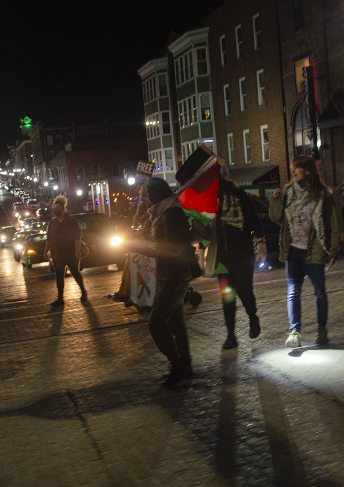  Protestors hold up traffic in a march down Court Street towards the Athens County Democratic Party headquarters for the Ceasefire for Palestine Rally in Athens, Ohio on Jan. 26. Photo Jessica Horner 