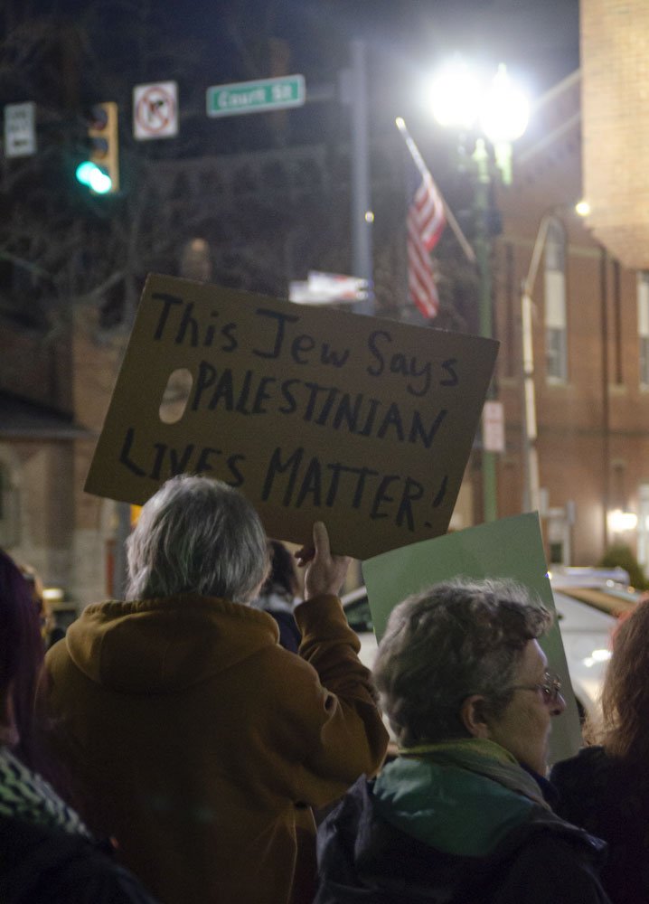  Protestors hold up traffic in a march down Court Street towards the Athens County Democratic Party headquarters for the Ceasefire for Palestine Rally in Athens, Ohio on Jan. 26. Photo by Jessica Horner 