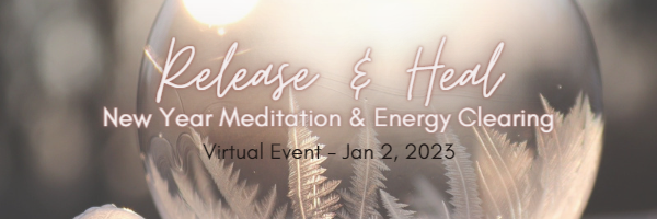 Glass ball with frosted design at bottom that resembles snow flakes.  Soft light shining through glass.