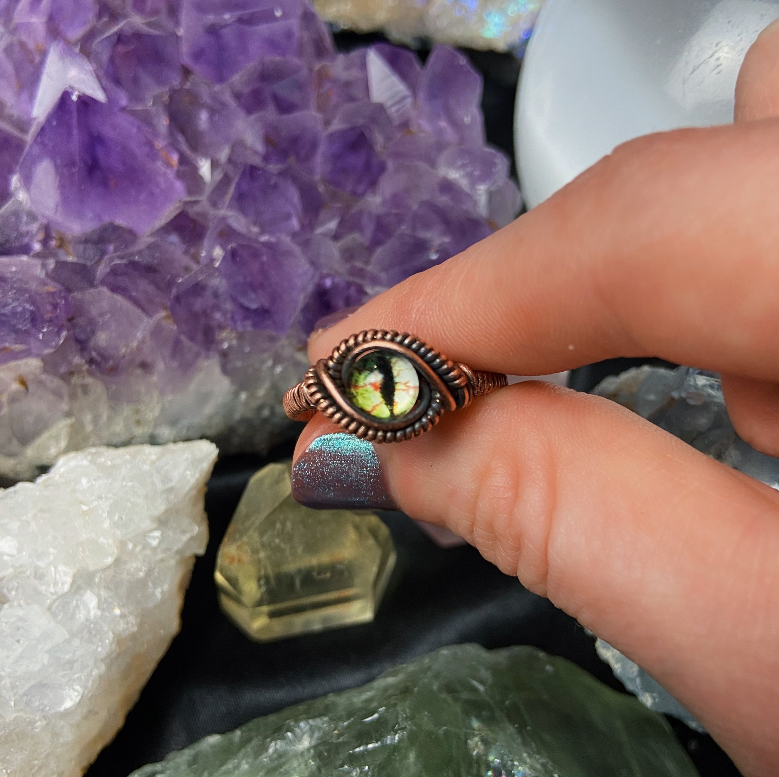 Dragon of Nature Eye Ring Held.jpg
