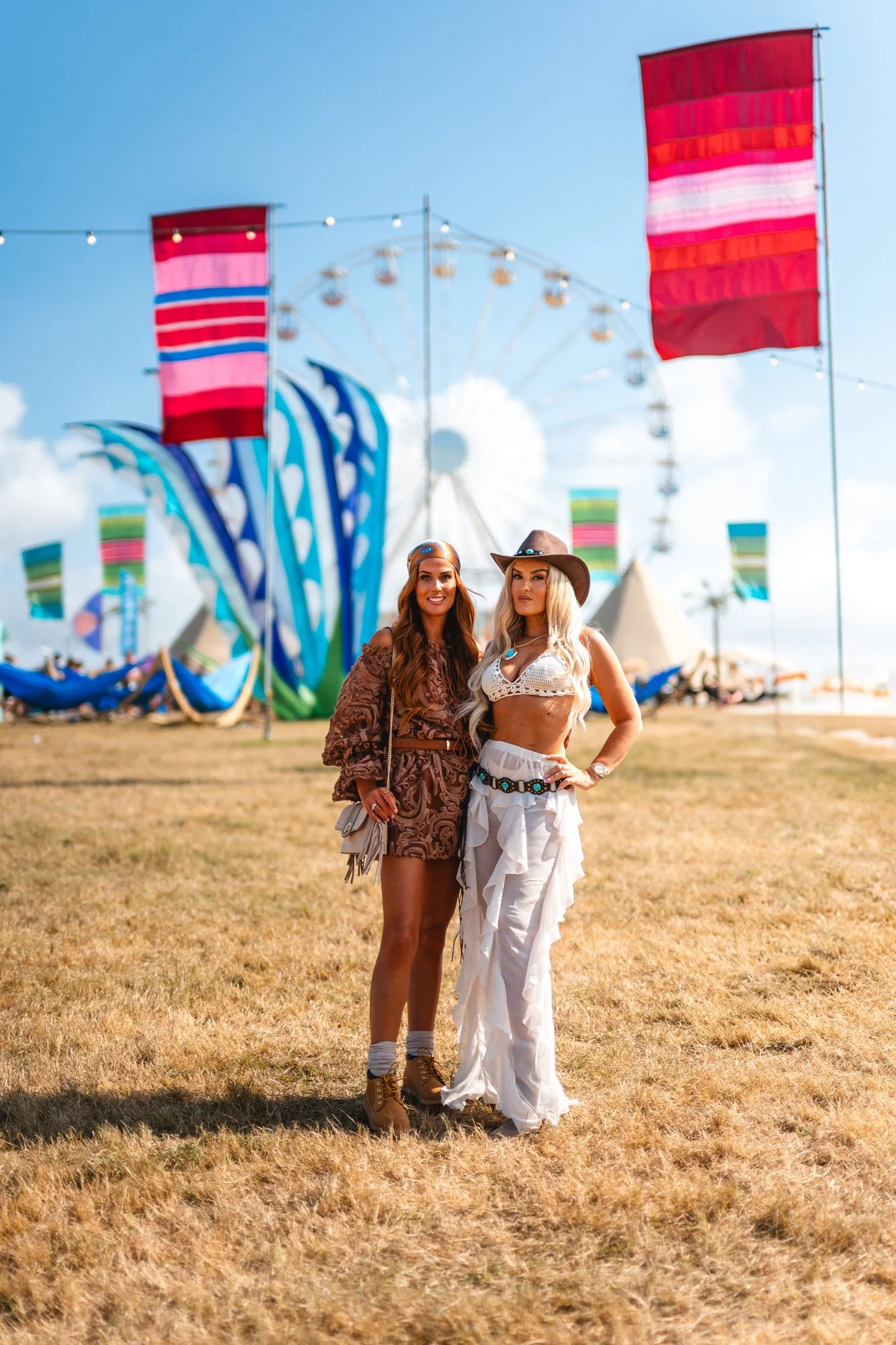 Smartly dressed festival goers enjoying the sunshine. Festival photographer