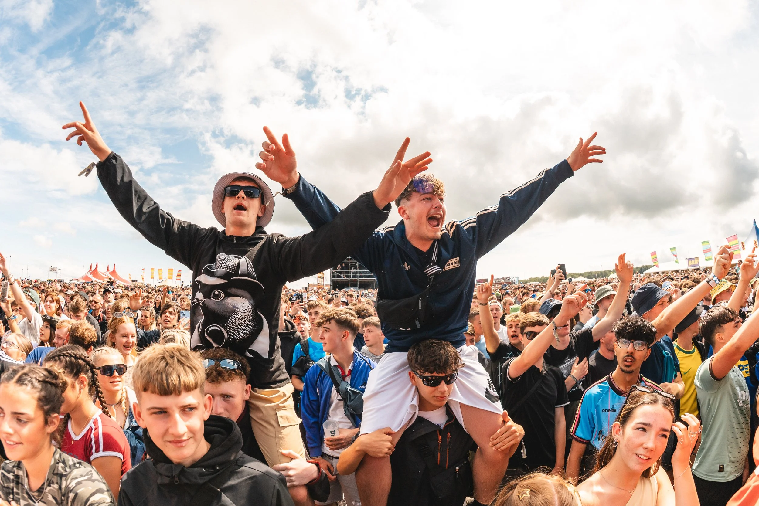 Lads on shoulders enjoying the music at Ynot festival. Crowd photography.