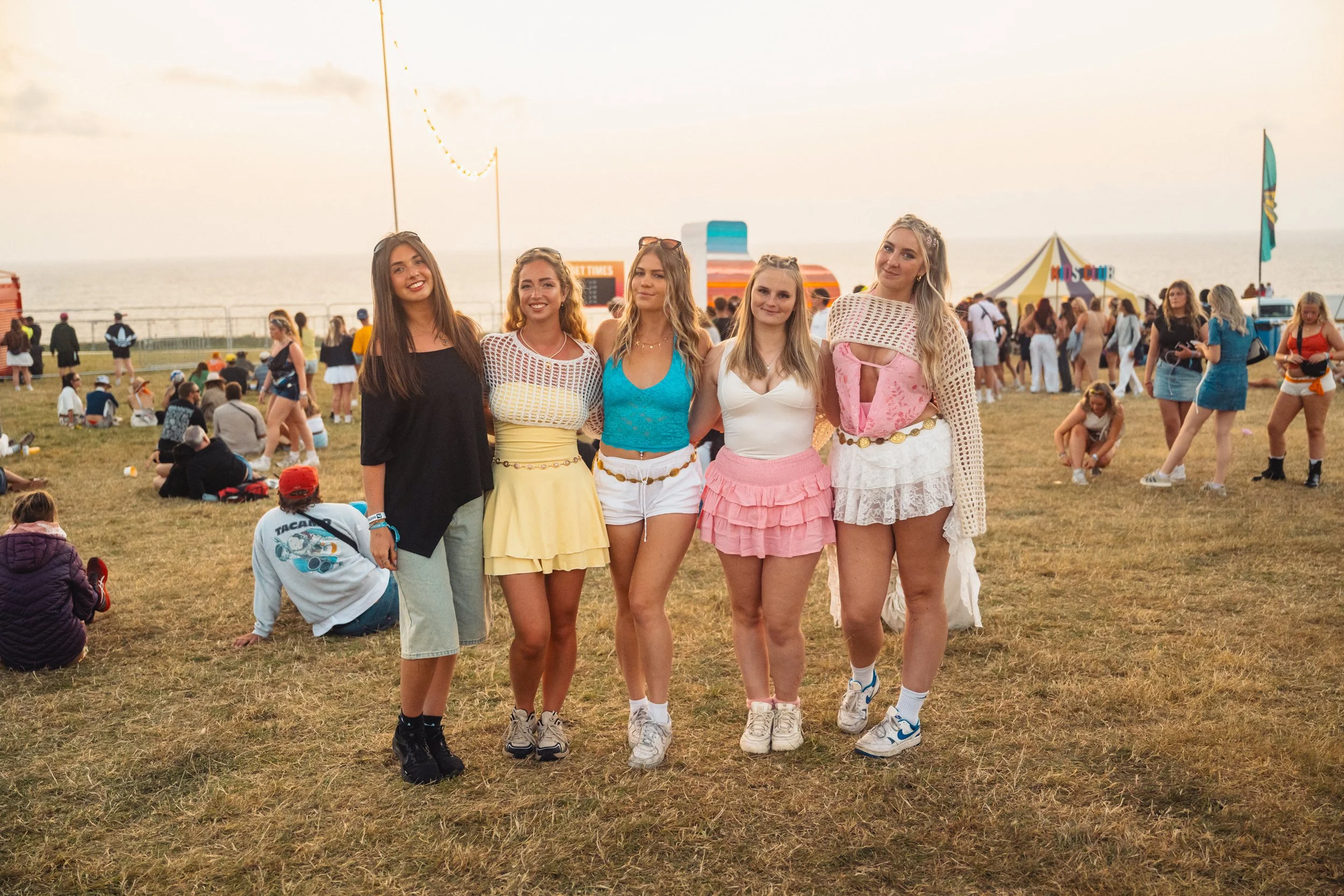 Group of girls dressed up for Boardmasters Festival, group photo.