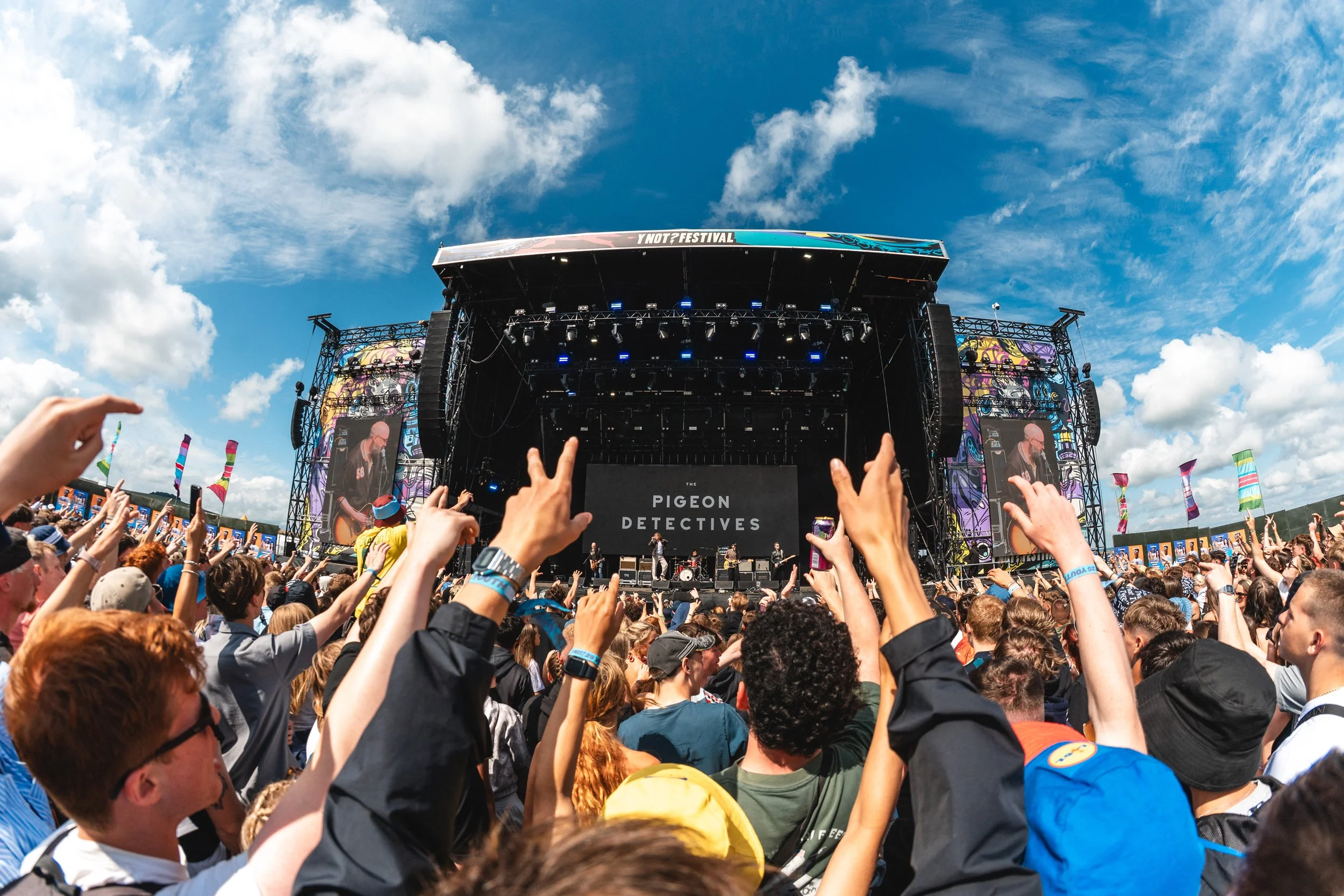 Crowd POV of the Ynot mainstage with the pigeon detectives amping up the crowd. POV Festival photography.