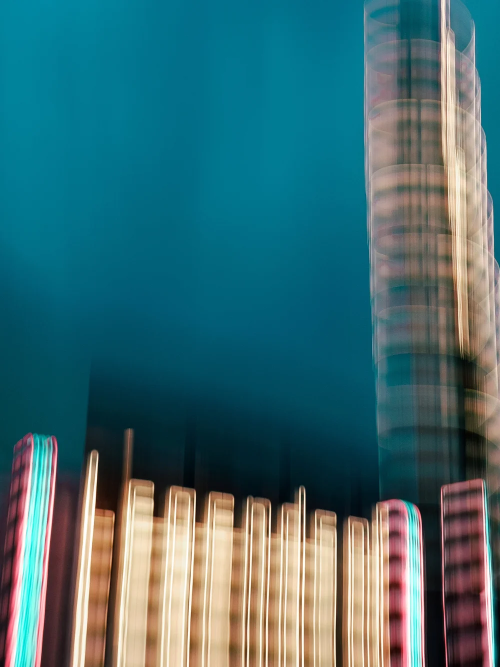 abstract photograph using intentional motion and blur. Neon sign reads legends features blue and pink and yelloww