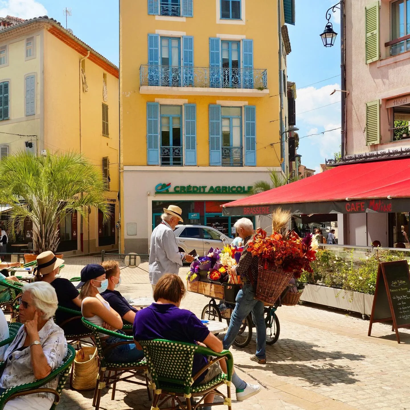 Flower seller trading outside Henry&rsquo;s Bar in Place du Frene Vence France

#flowersellervencefrance