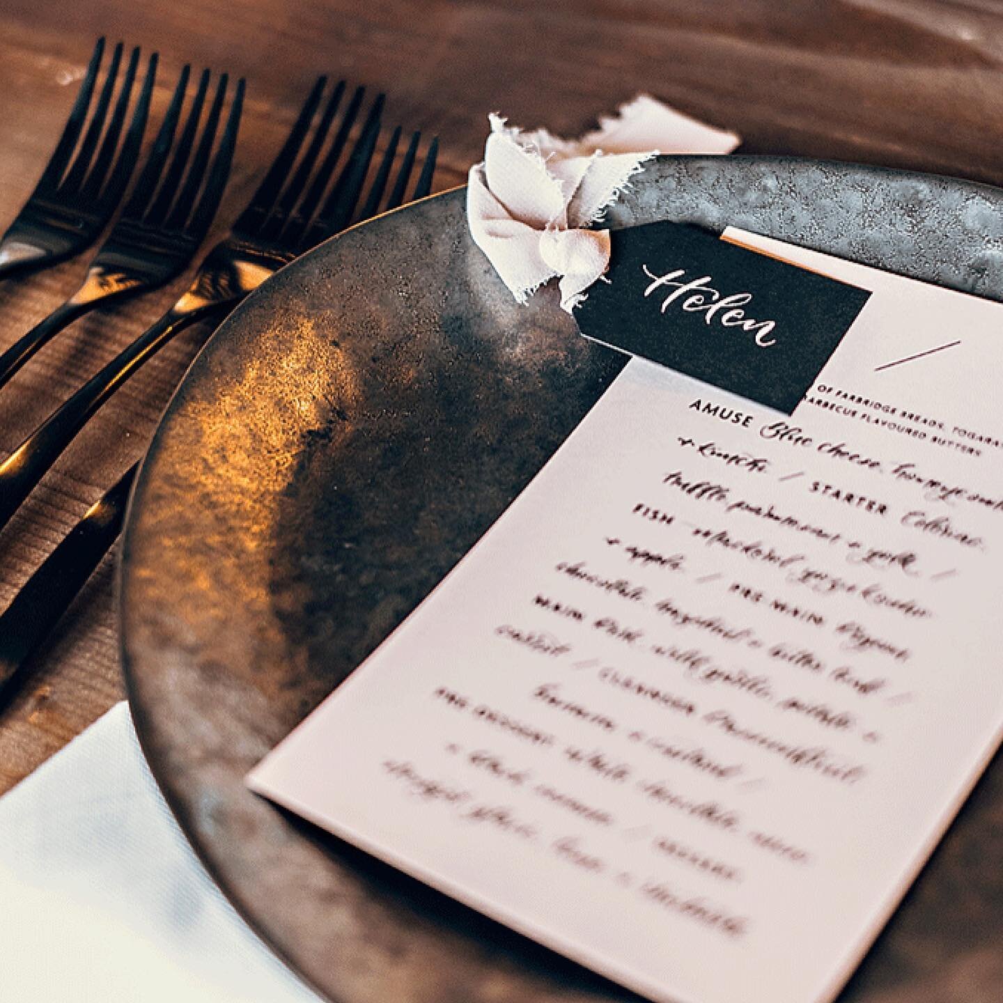 PLACE SETTINGS // Gift tags are a great way to add a place card to your table setting in a slightly different way. We used a bold black tag and paired with a chiffon ribbon to soften up this wonderfully industrial tablescape. Place cards are a great 