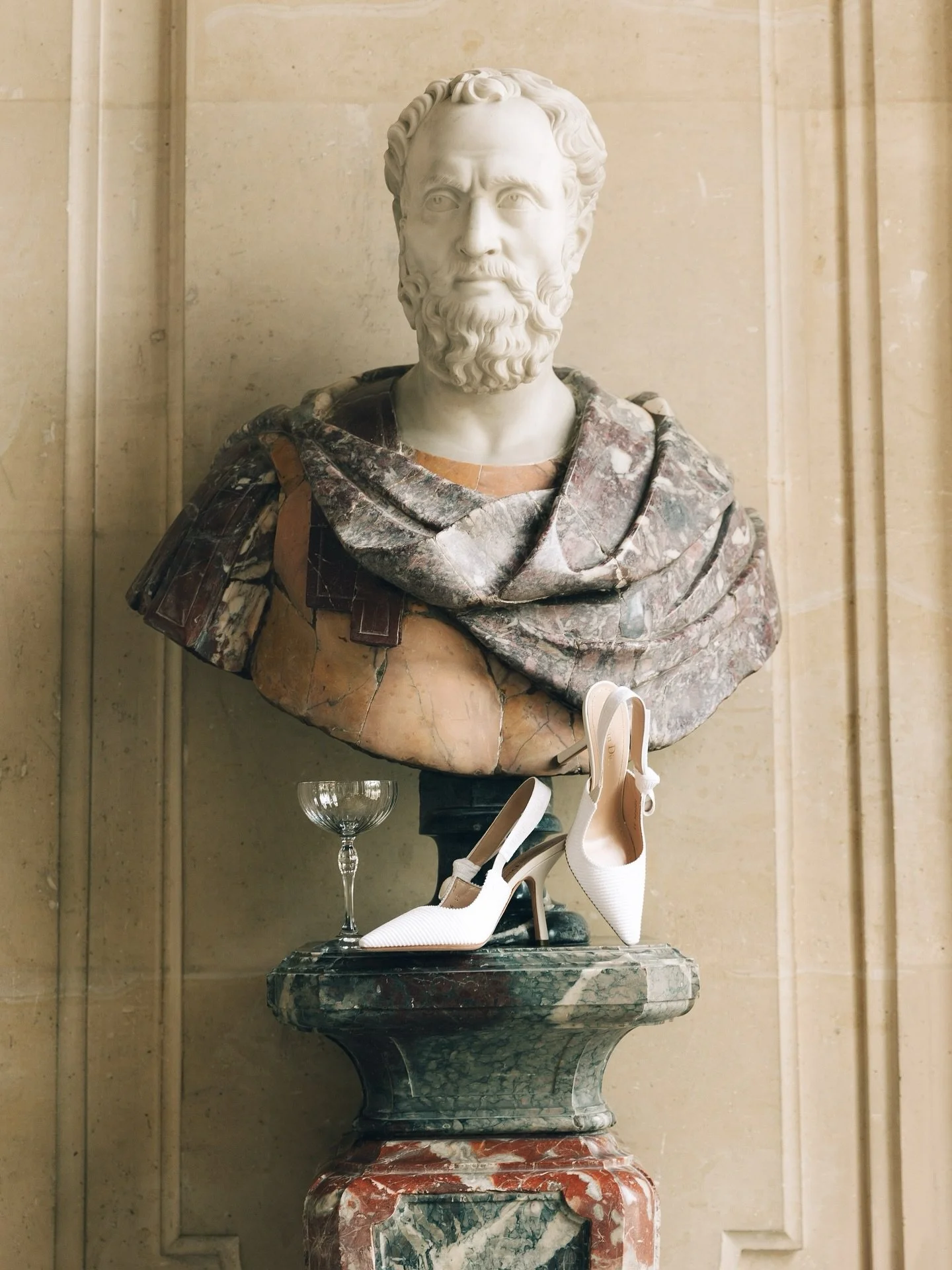 Dior, Champagne glass and a marble bust, 2025, Paris 🤍 
.
.
editorial wedding photography, Wedding photographer Scotland, wedding photography Scotland, destination wedding photographer, film wedding photographer, Edinburgh wedding photographer, Edin