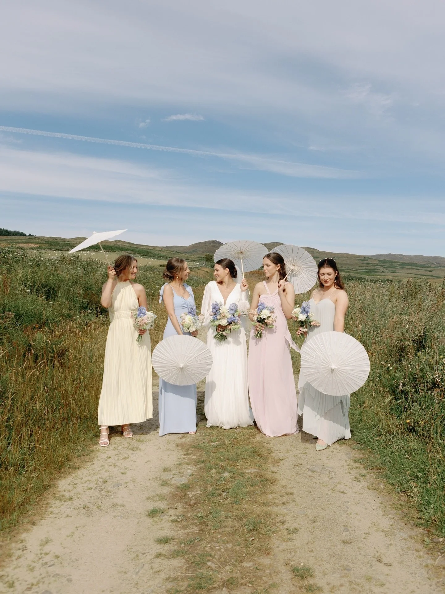 Happiness is blue skies, parasols, friends and pastels 🤍
.
.
Photography &mdash; @meggymacphotography 
Venue &mdash; @crear_weddings 
Florals &mdash; @blooming_wild_crear_flowers 
Content &mdash; @wrencreatives 
Dress &mdash; @annepriscillabridal 
M