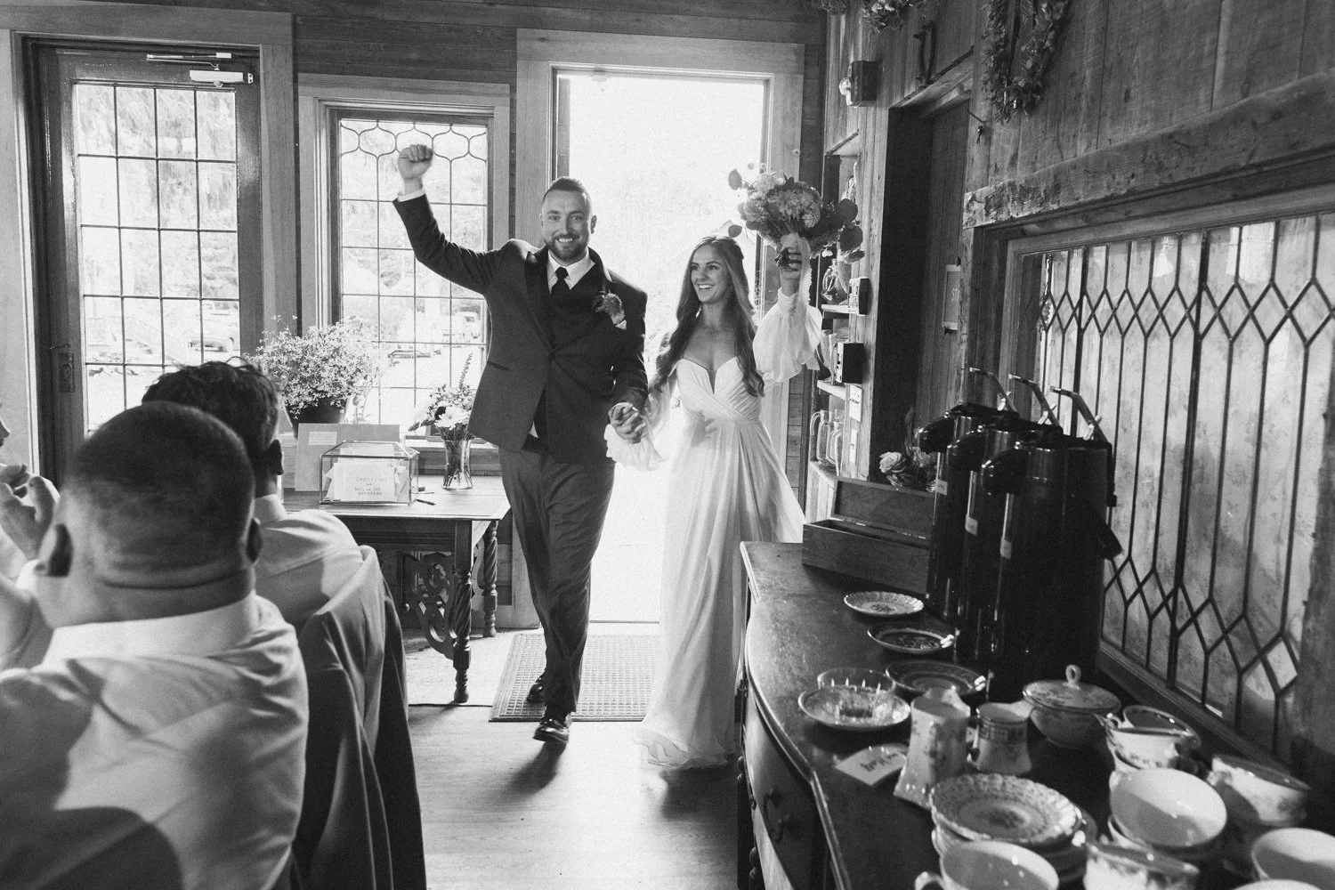 A bride and groom enter their wedding reception during a wedding at western massachusetts wedding venue Gloriosa & Co in Ashfield, Massachusetts.