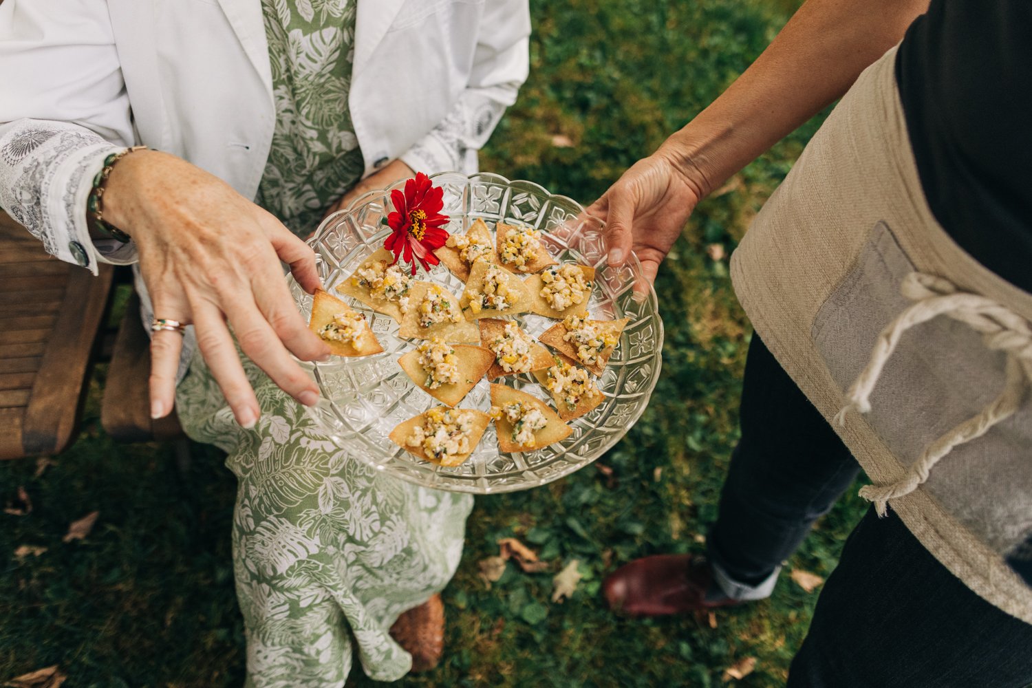 A wedding guest enjoys food during a wedding at western massachusetts wedding venue Gloriosa & Co in Ashfield, Massachusetts.