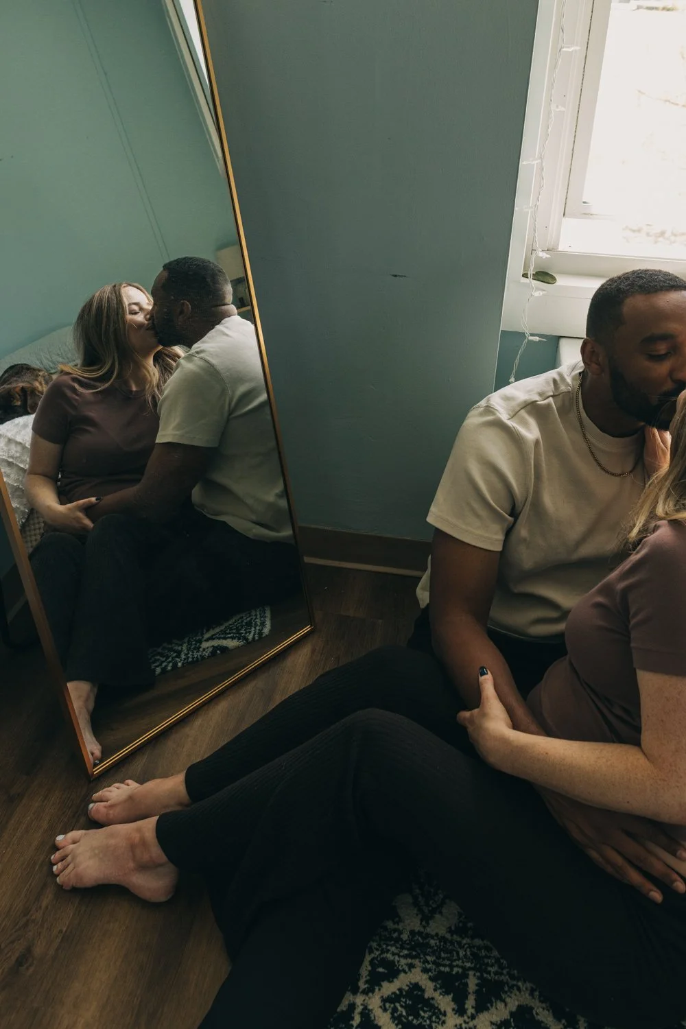 A couple embraces during a maternity photo session in western massachusetts.