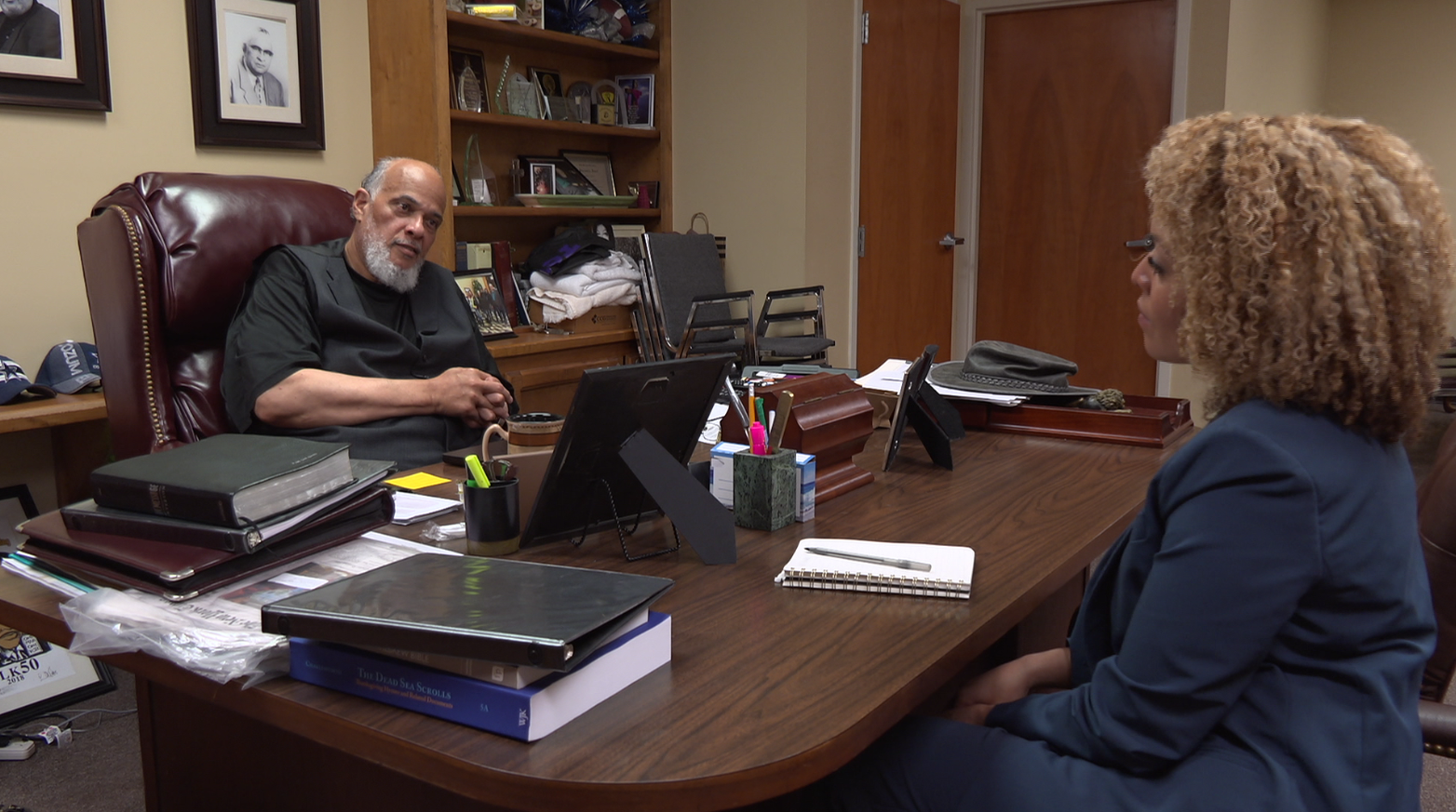 Ashley Moss interviewing a community member