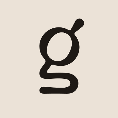 Black lowercase letter 'g' on a light beige background.