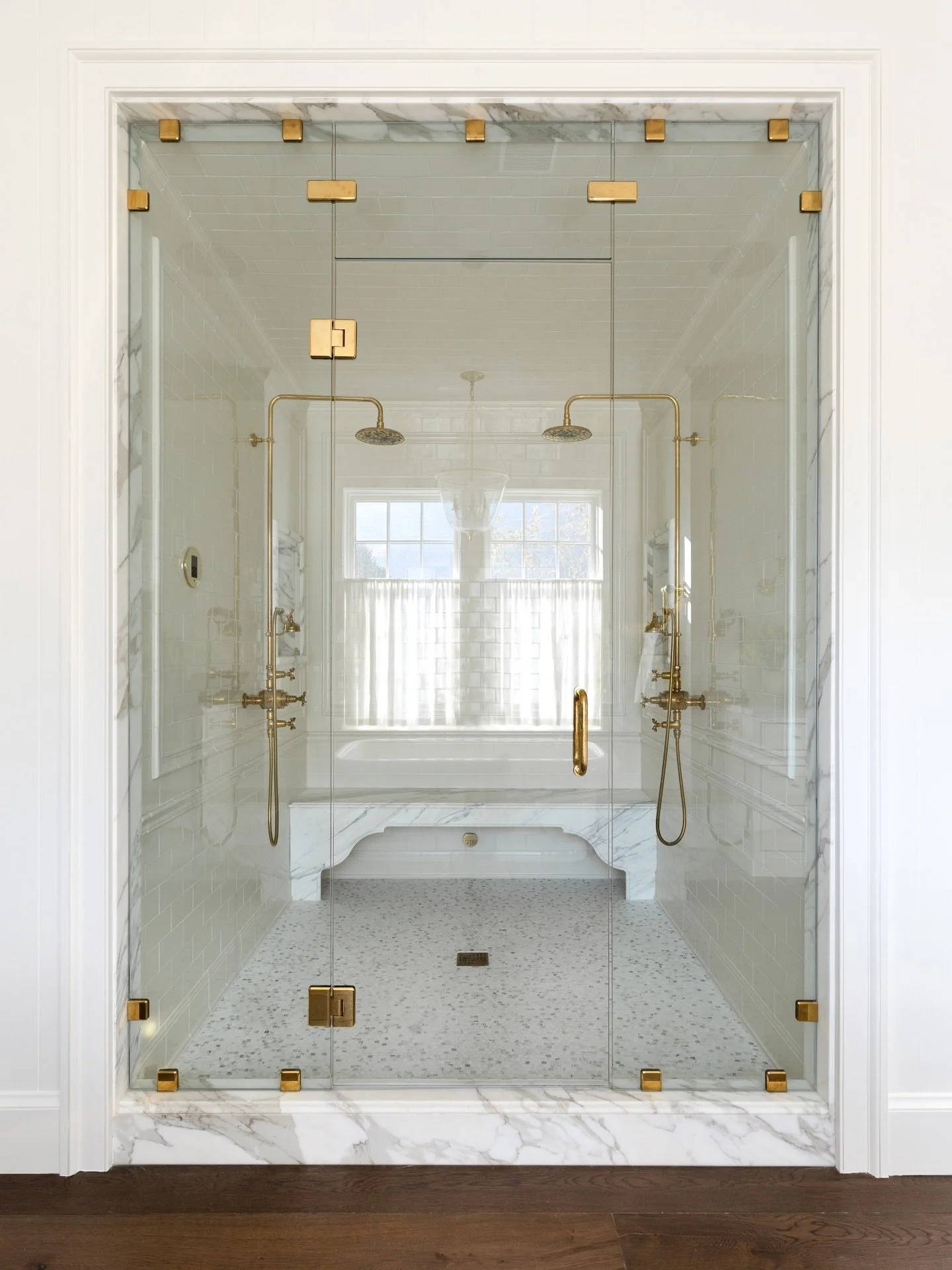 The luxury bathroom of our dreams 💭 from the custom marble bench to the beautiful brass fixtures this bathroom exudes luxury and class at the highest level.

Designer: @alexadamsondesign 

#bathroominspo #custommarble #masterbathroom
