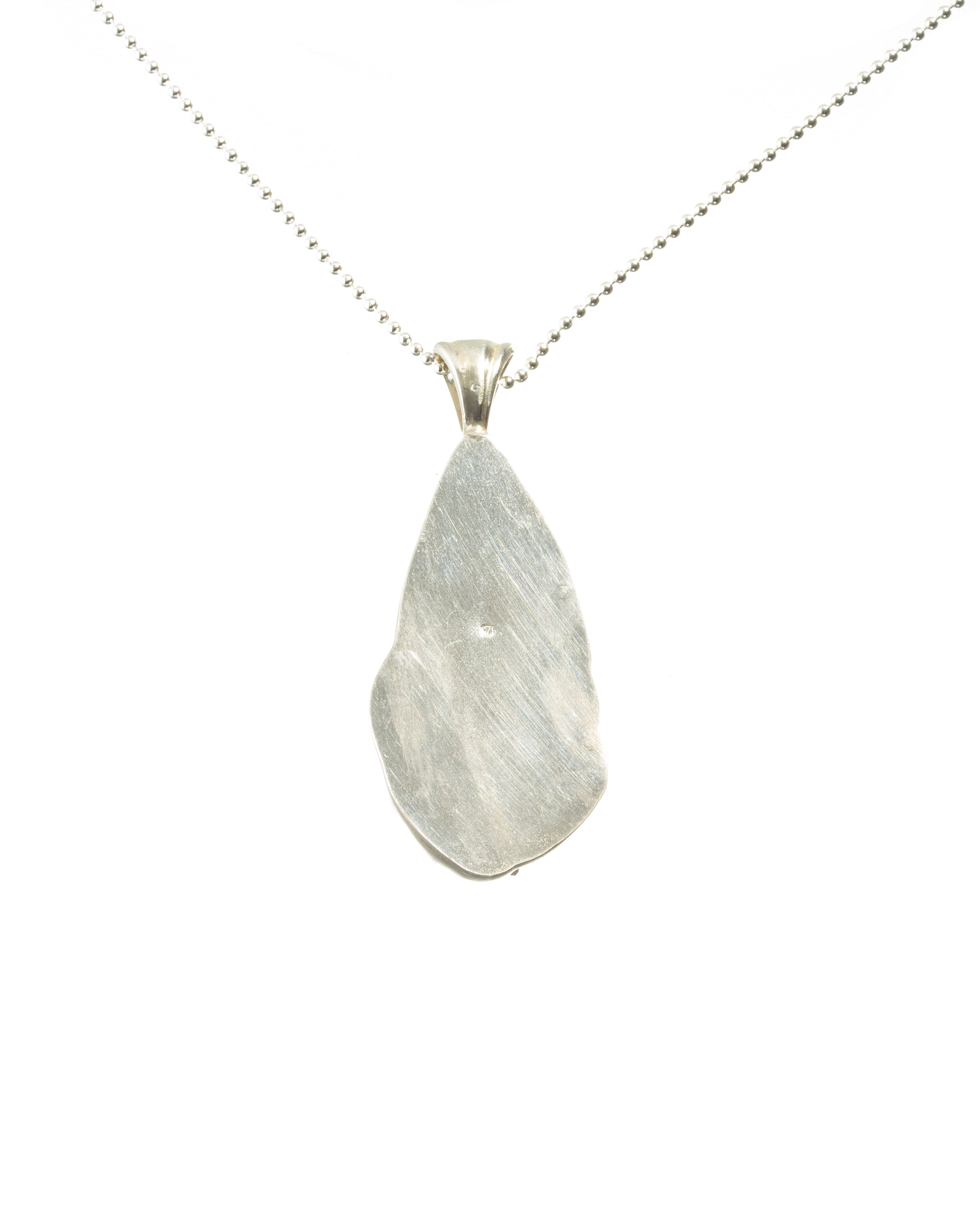 Marbled druzy cabochon with nested pearl, sterling silver pendant with sterling silver chain.