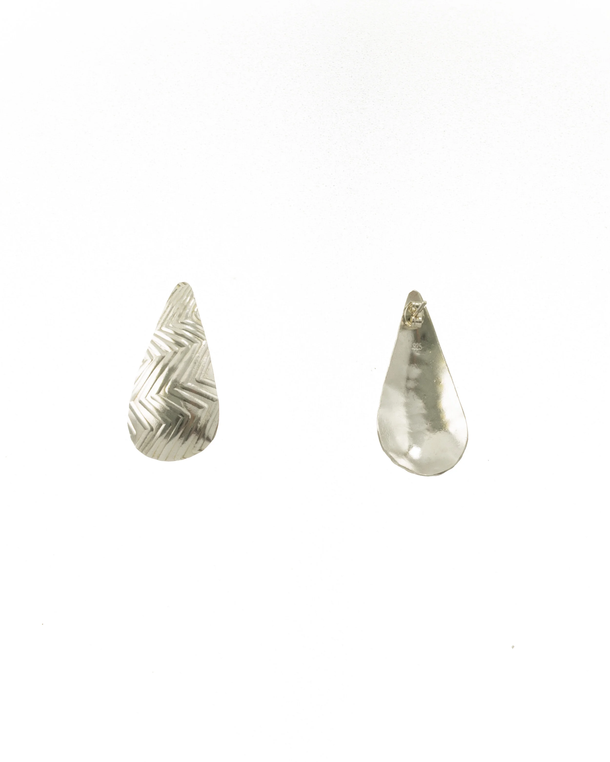 Textured (zig-zag pressed design) sterling silver teardrop earrings on posts.