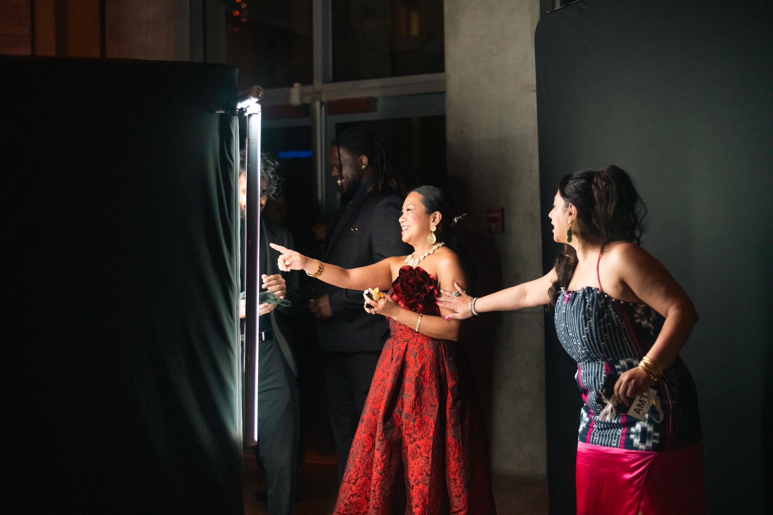 Guests laughing at their scribble booth video at a black-tie event, scribble booth rental Toronto by MDRN Activations