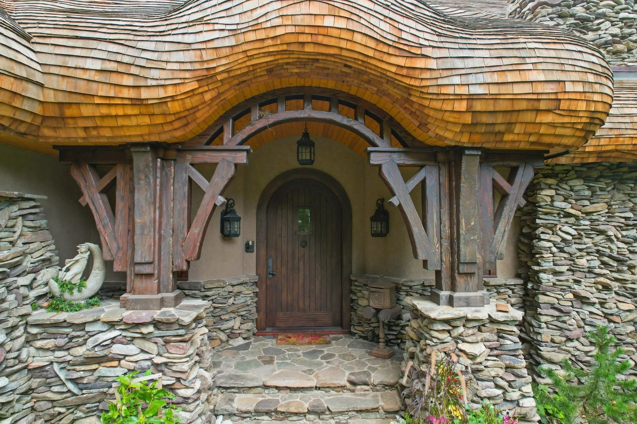 False thatched mushroom style cedar roofing captured in a recent photo shoot.  Amazed at the beauty and expertise that created this unique wonder.  @huberroofing
