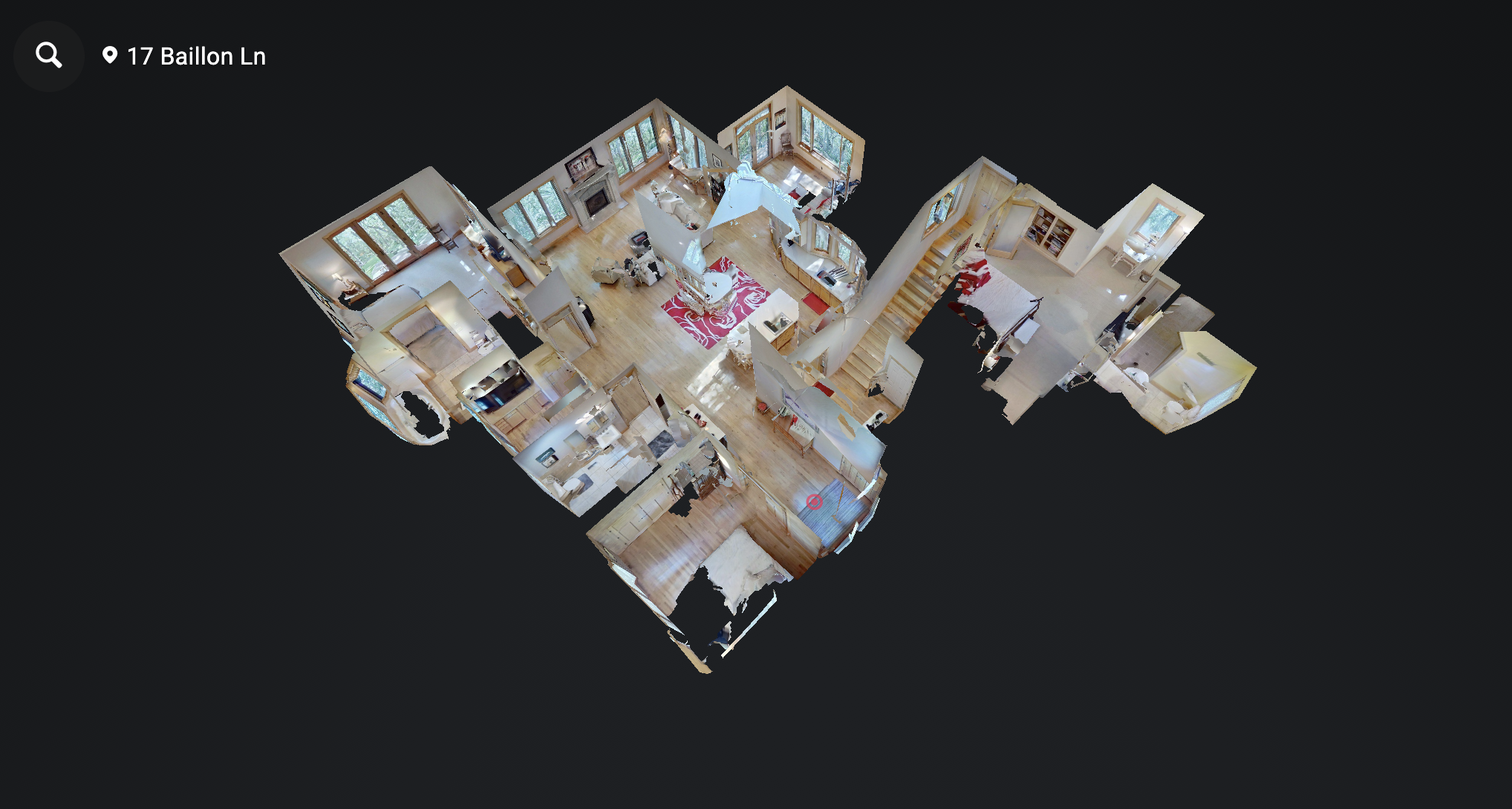 3D aerial view of an open-concept house interior showing multiple rooms with furniture, hardwood floors, and large windows.