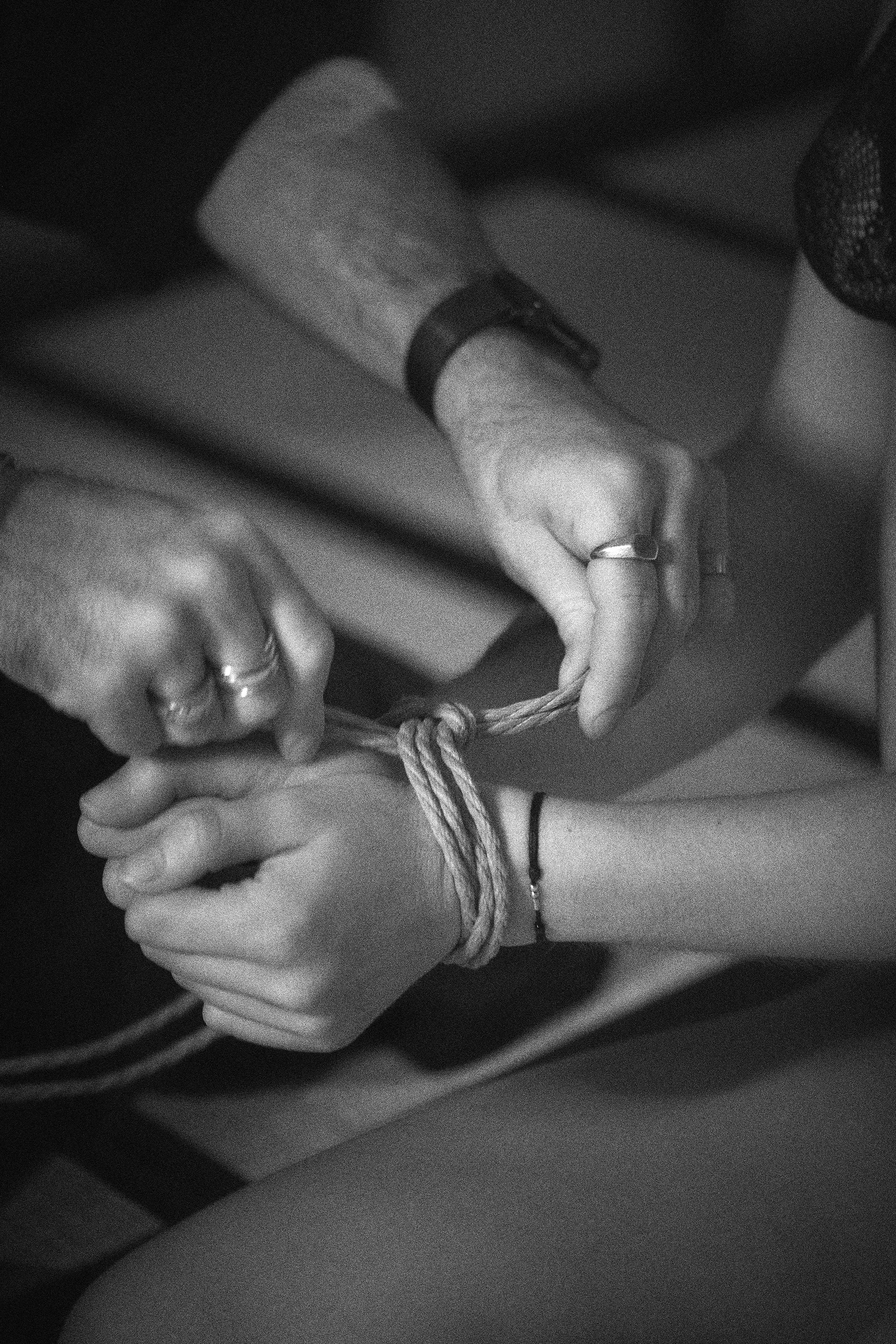 Shibari wrist tie close-up — rope safety and technique