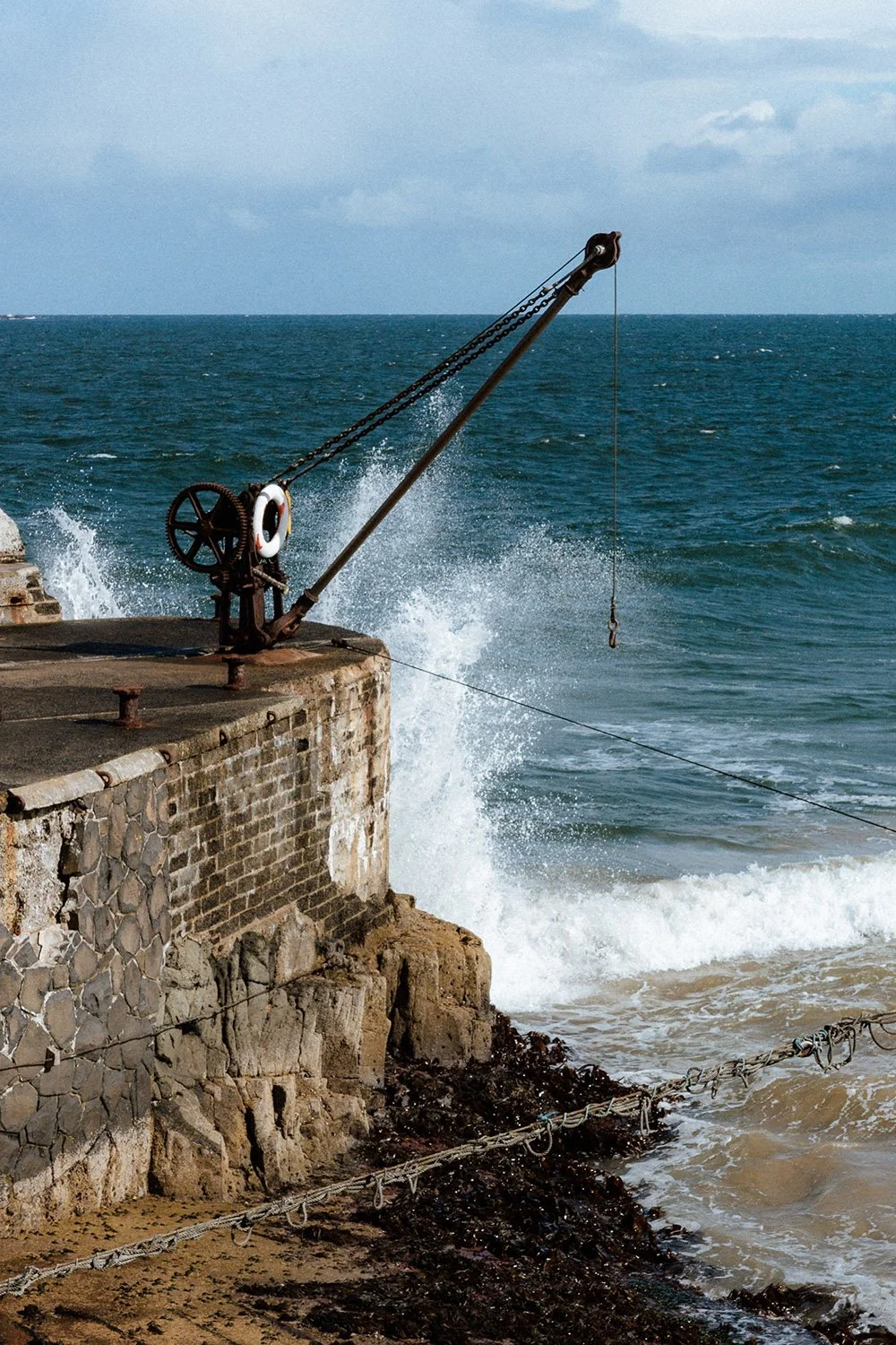 Photo of small crane on the Portrush shore