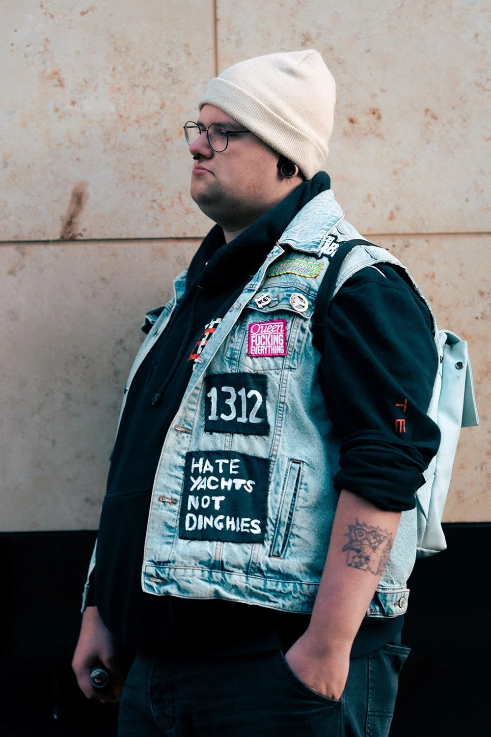 Man in a hat outside Queen Street Train Station.jpg