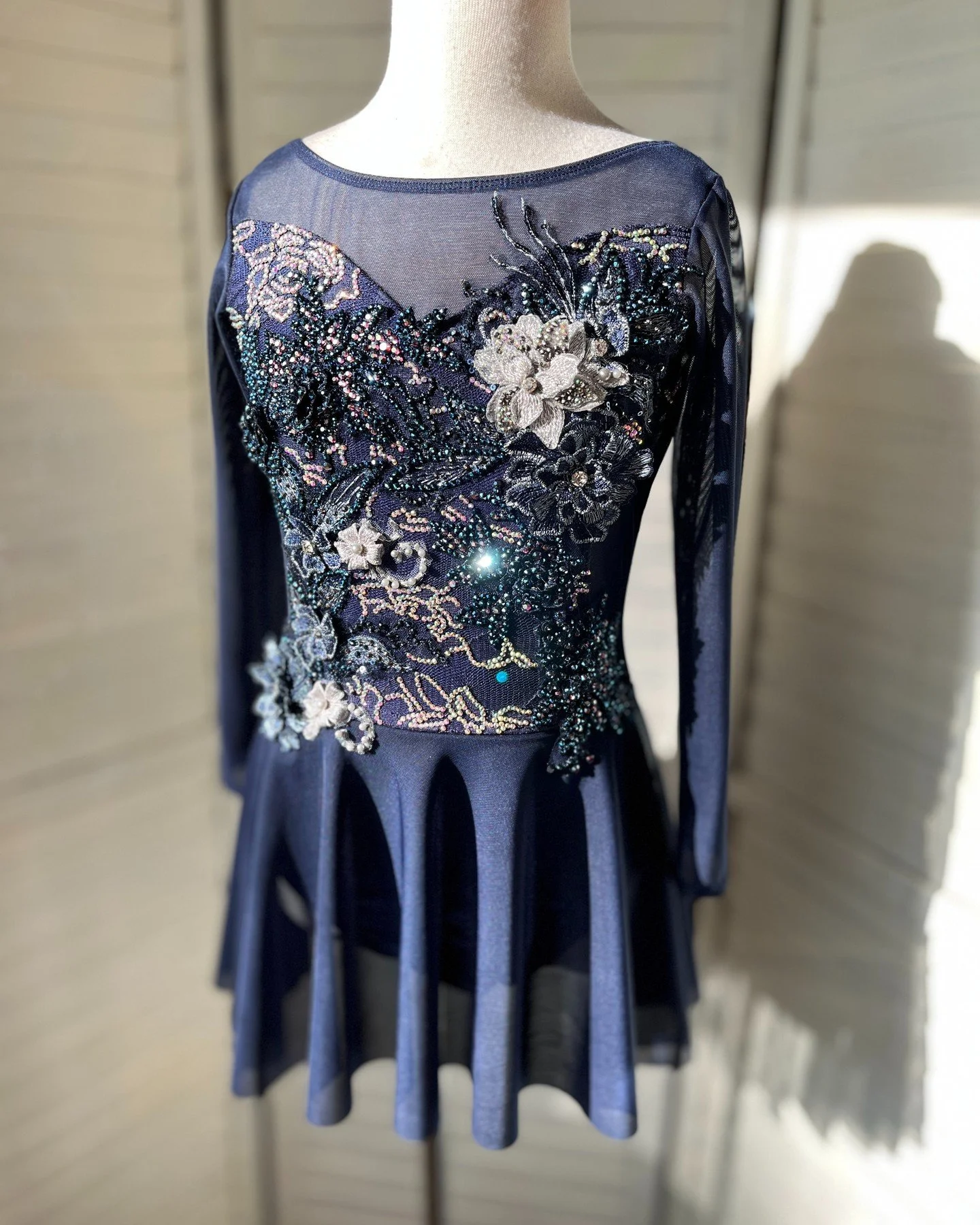 For sale and ready to wear! NEW! Custom navy lyrical or contemporary open back dress with appliqu&eacute;s and beautifully/fully rhinestoned! Skirt slightly longer in back. 
Child med, size 10
Bust 28-30 in
Waist 23.5-25 in
Hip 29-30.5
Girth 51-52.5 