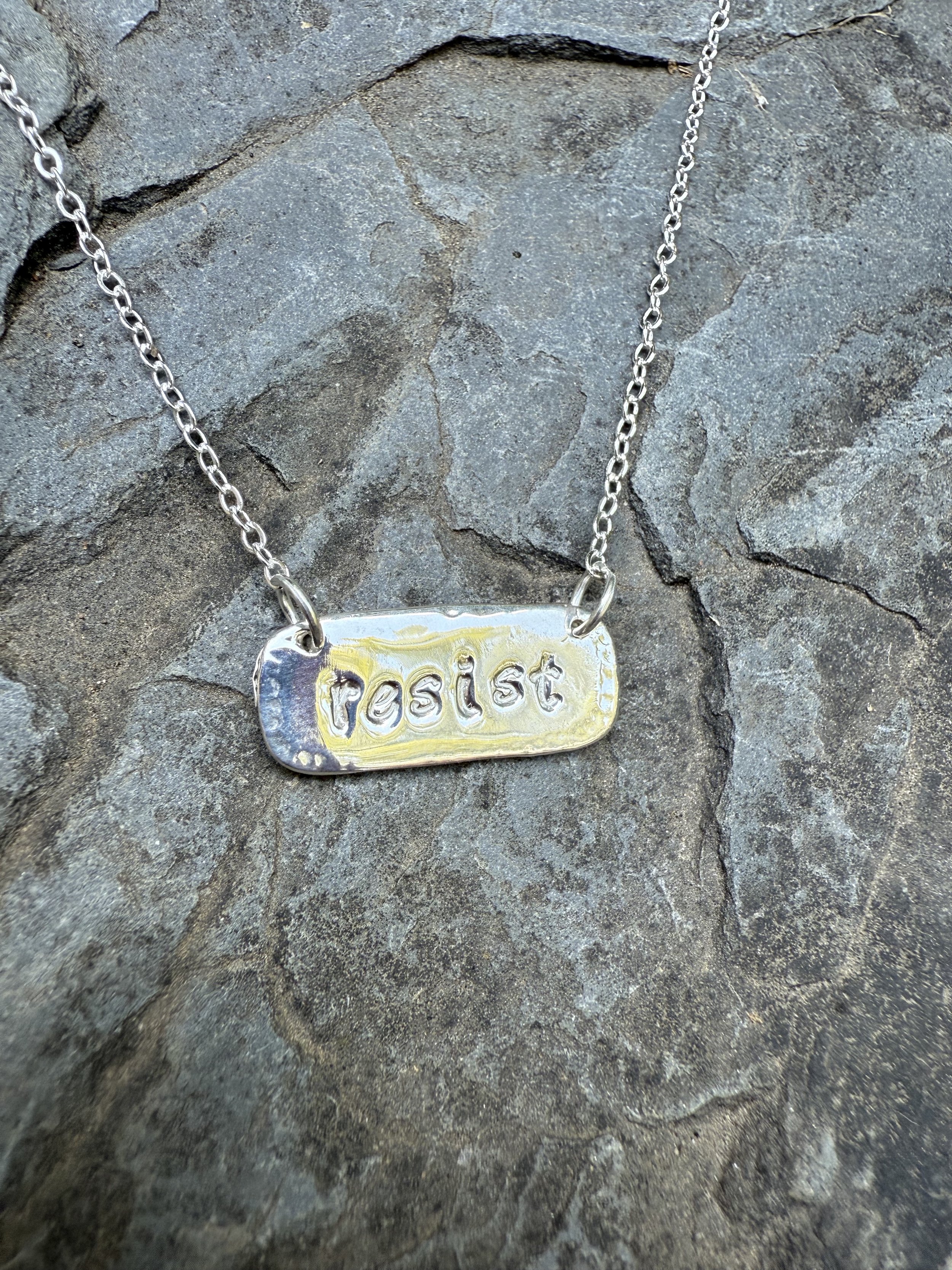 resist lowercase silver.jpg