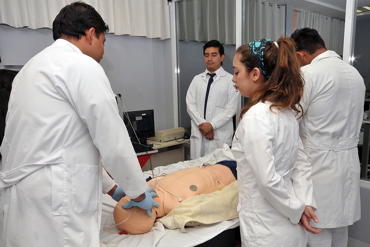  Trainees in Mexico participate in a medical simulation.  