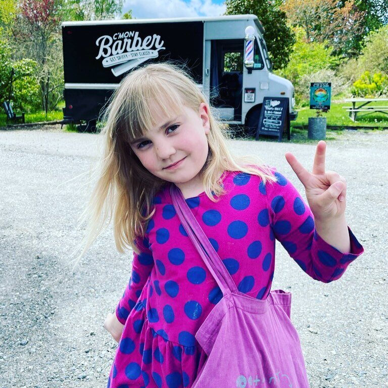 Luna Day rocking her bang trim after a busy morning doing a bake sale for her scout troop. Add in a little chill time with &ldquo;Moana&rdquo; while mom got her ends trimmed. #familybarber #vashon #pacnw #bangtrim