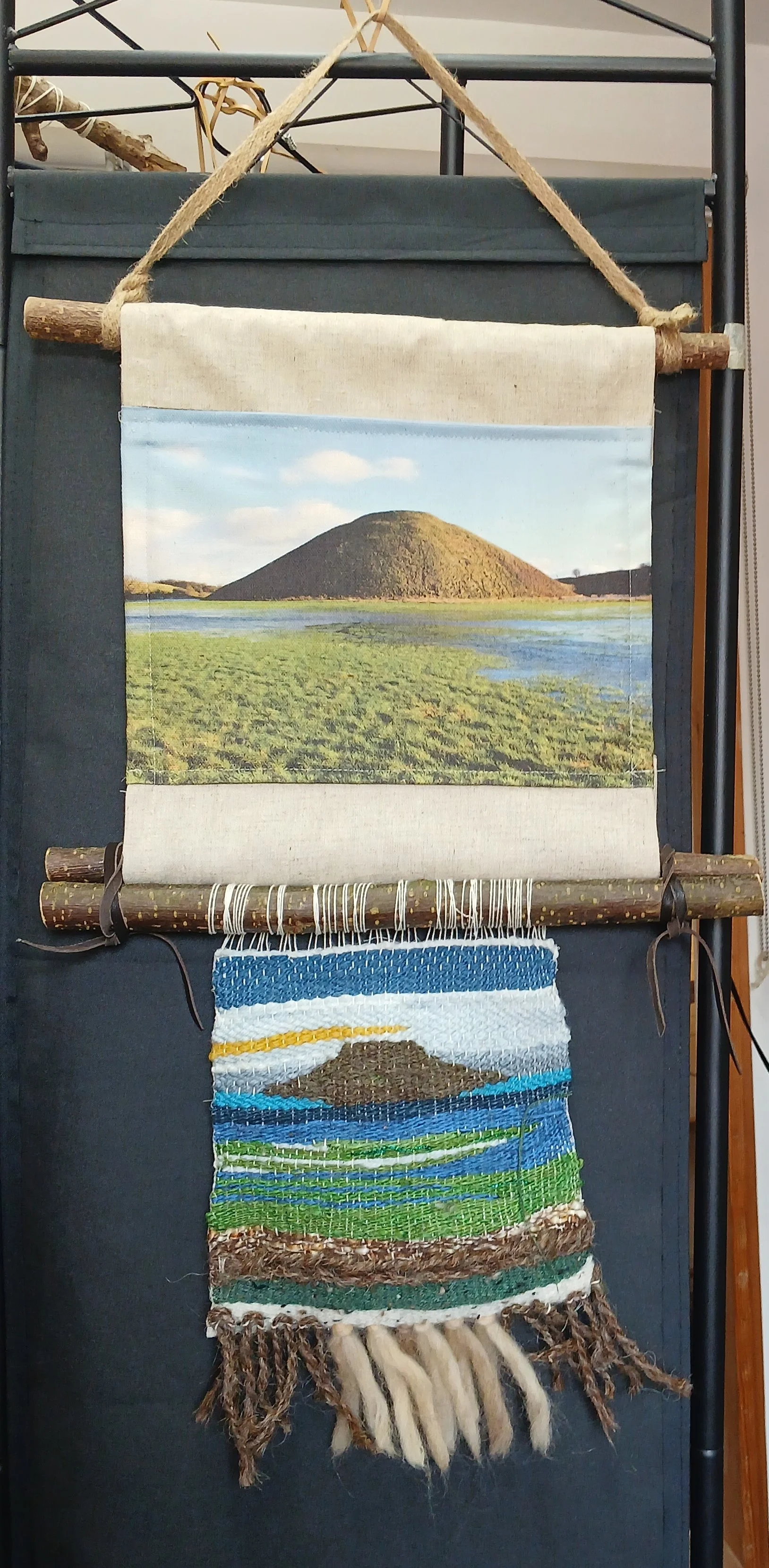 Silbury Hill, Avebury. Hand-Loom Weaving wall hanging in natural yarns hung on cut Hazel.