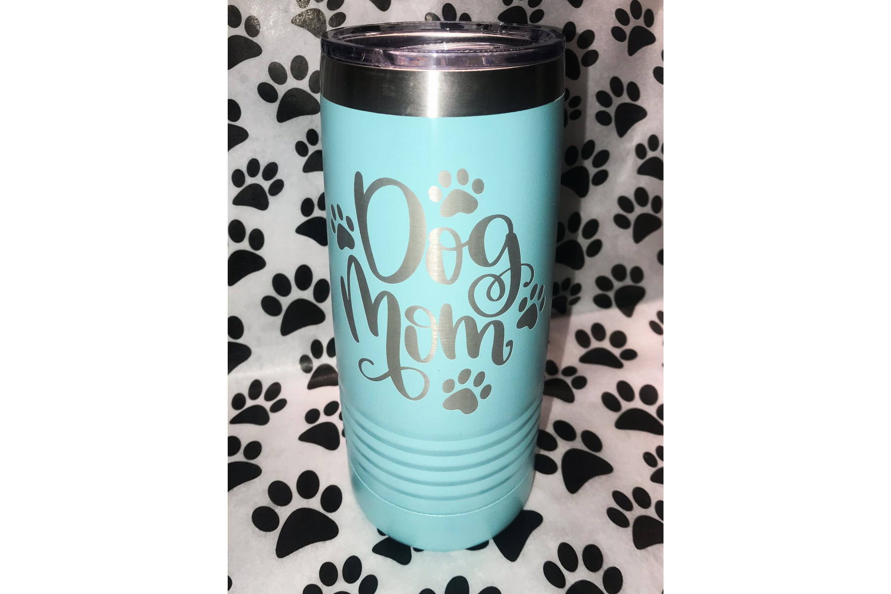 Image of Tumbler. Teal color with phrase Dog Mom in script and small paw prints.