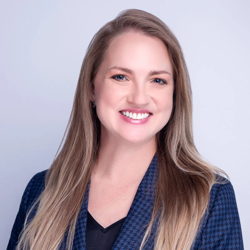 Woman in smilling in headshot at Mo Lima Photography