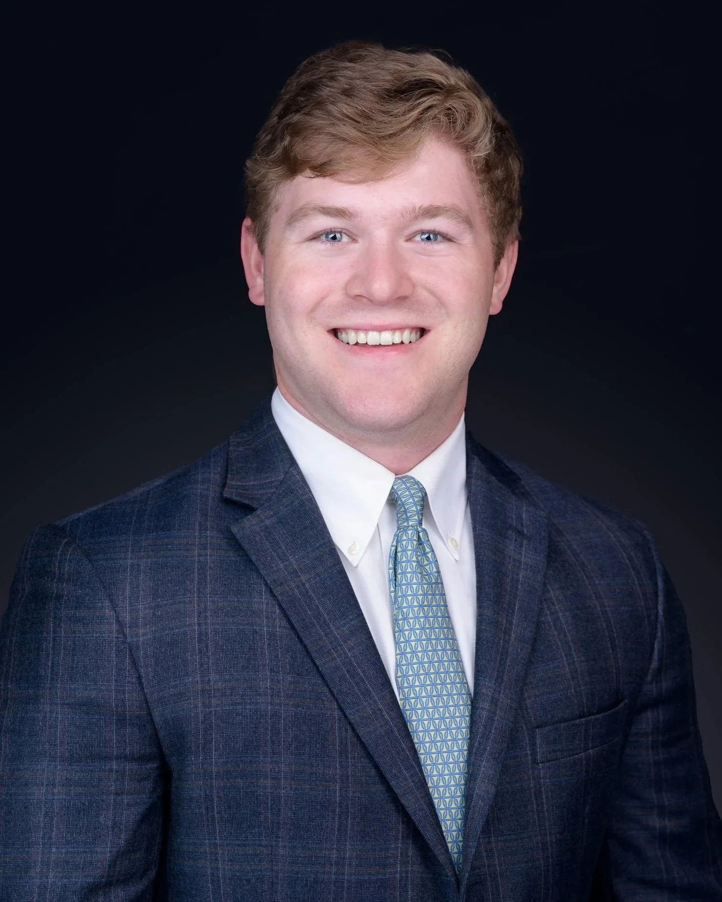 headshot of a young man who's a recent graduate school graduate
