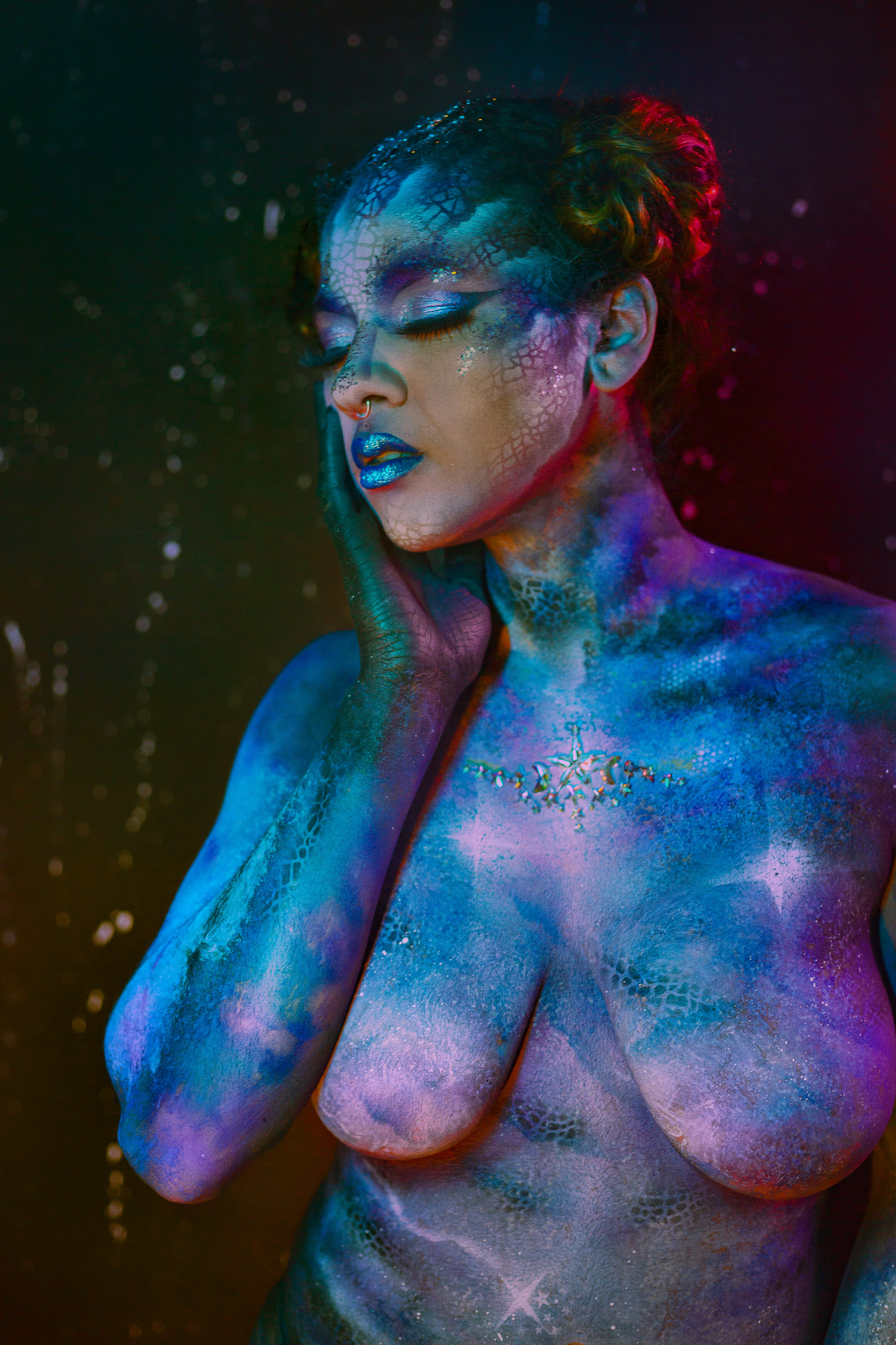 bipoc portrait with starry galaxy bodypaint and space buns with colorful lights