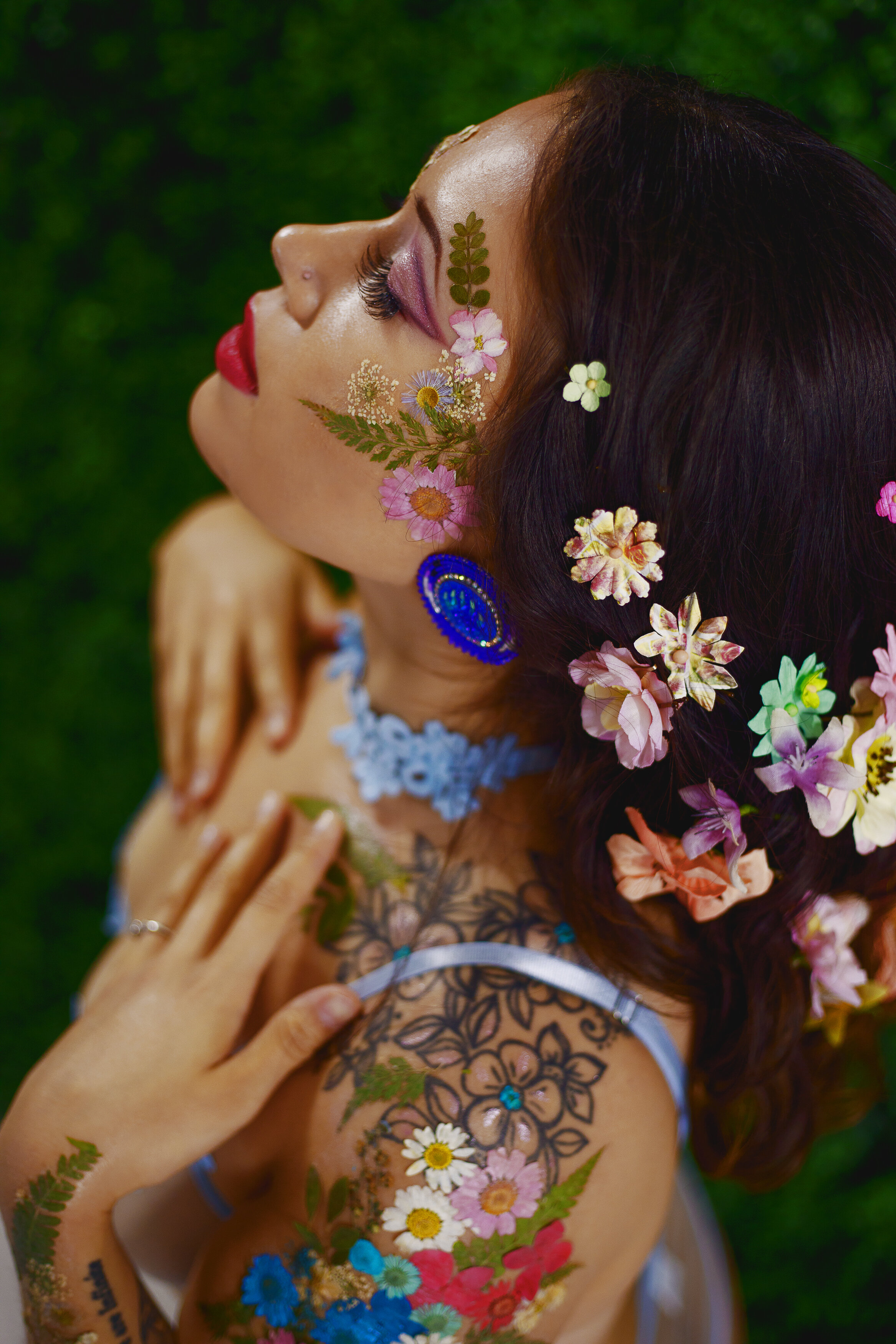 edmonton fantasy floral vogue inspired portrait bipoc woman in floral design beside plant wall