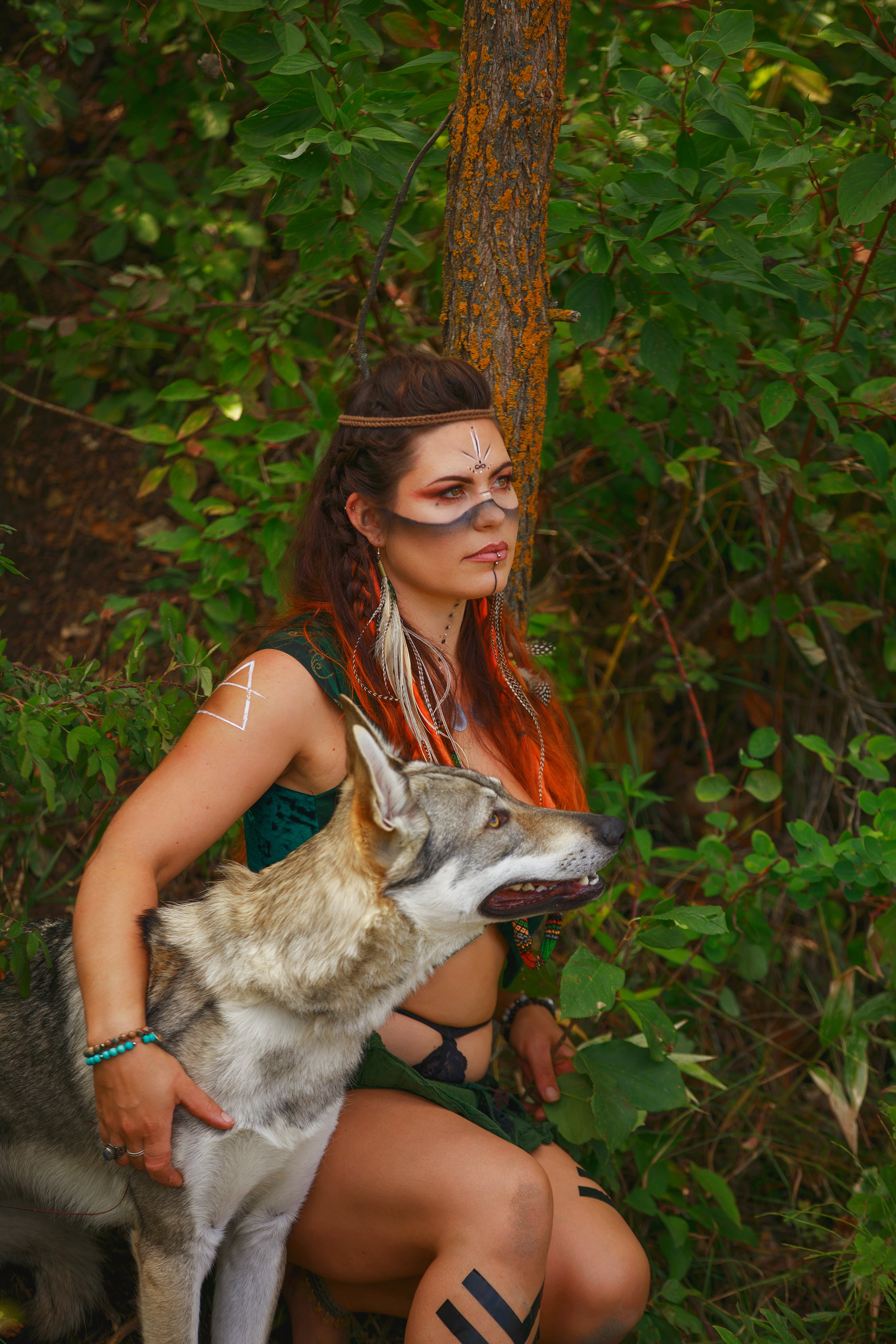 edmonton bipoc metis portrait photography woman with wolf in forest