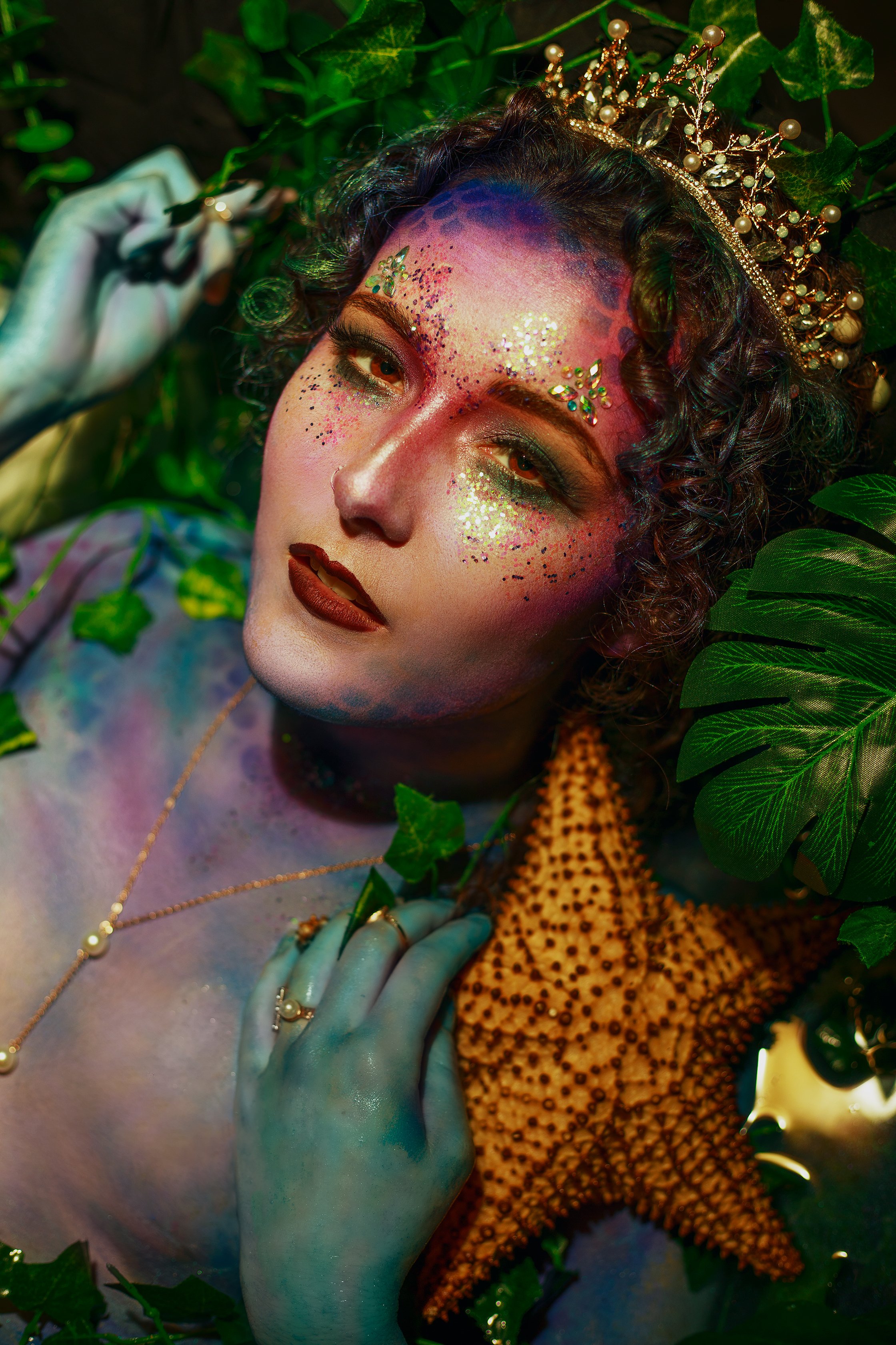 edmonton fantasy mermaid boudoir portrait creative makeup photography gorgeous woman with starfish bodypaint and pearl crown
