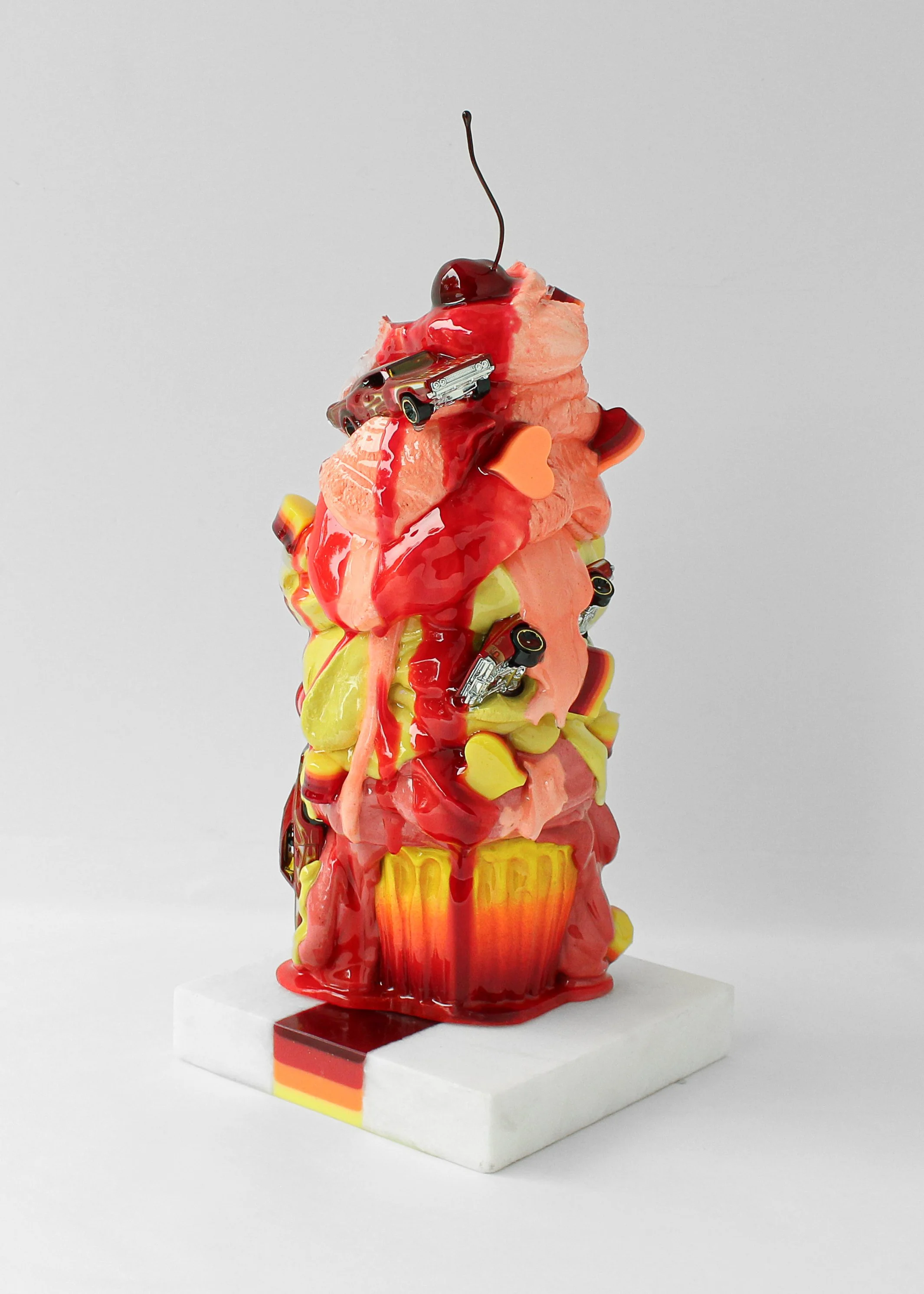 Fuego is My Passion_15inx6x6in_pigmented cement, resin, alumin dicast on a resin and marble inlay base_$2,000_-3.jpg